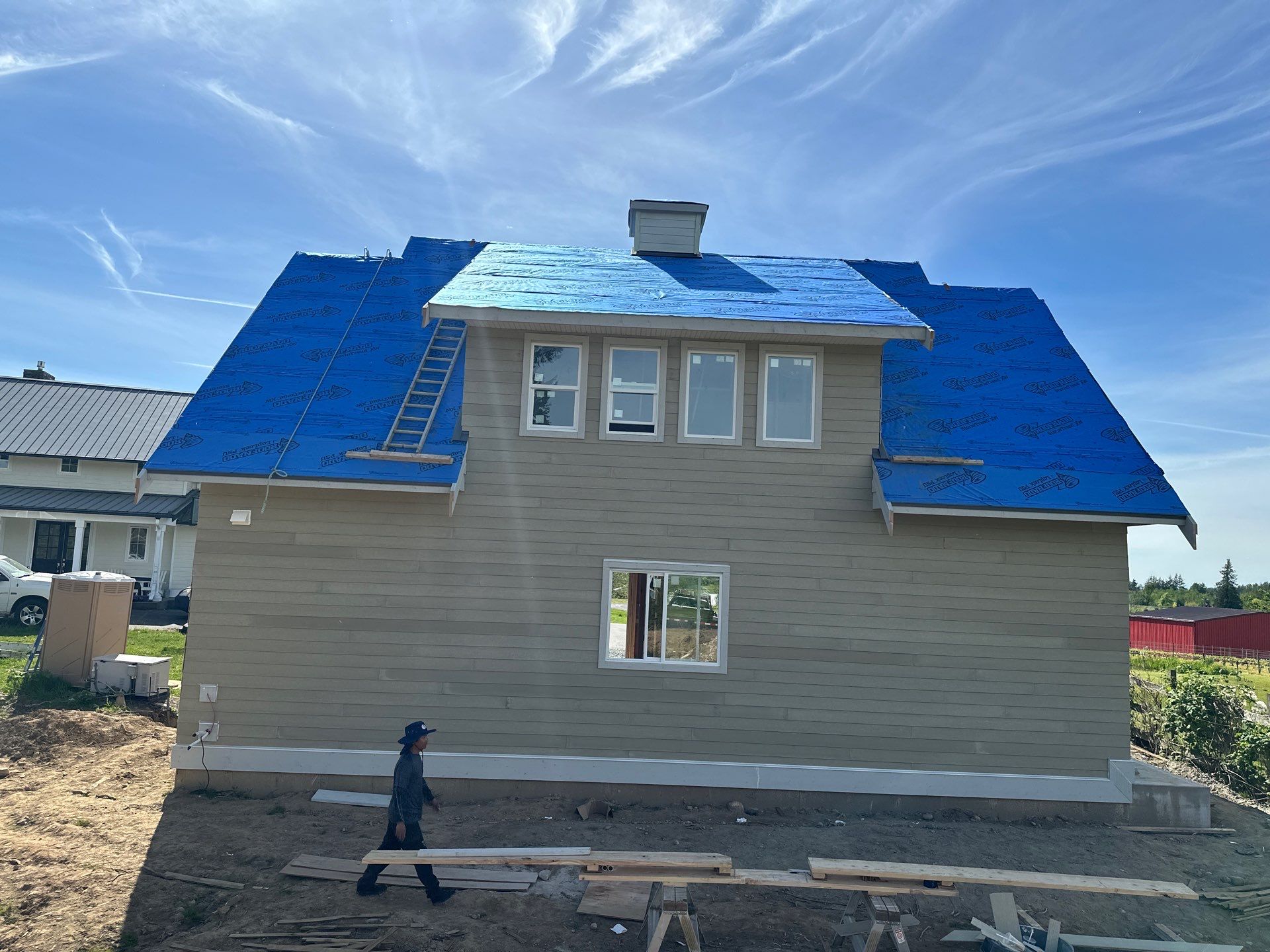 Residential Roofing Installation using 12" Prolok metal  by Top Notch Roofing Inc