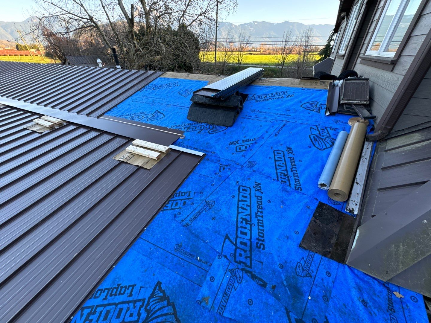 Residential Roofing Installation using 12" Prolok metal  by Top Notch Roofing Inc