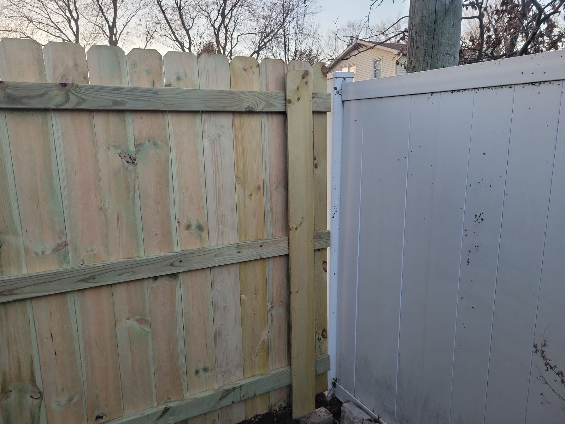 New Pressure-Treated Wood Privacy Fence and Gate in Charles City by Perfect Picket Fence and Stain
