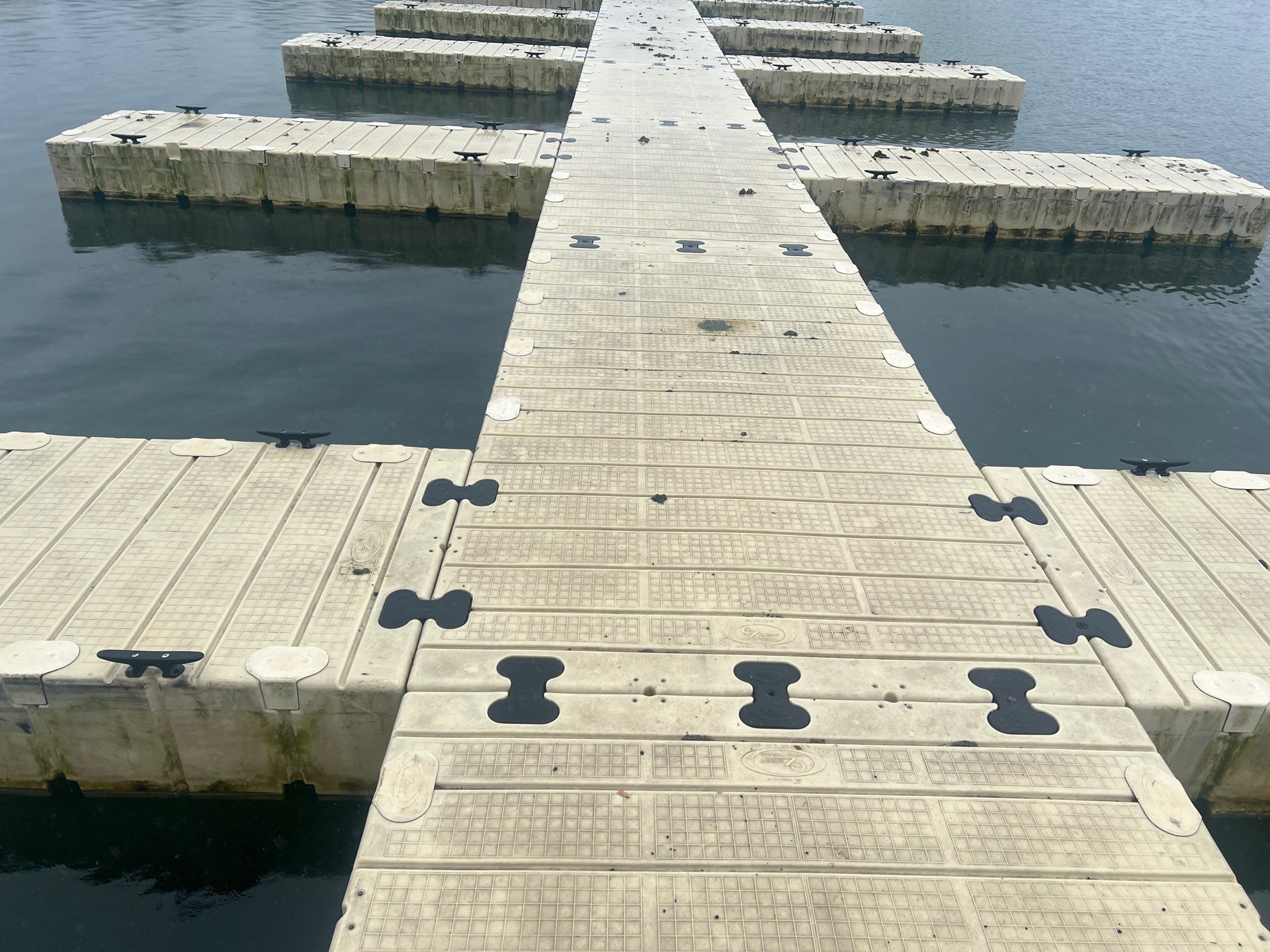 Power washing of floating dock by Northern Power Washing LLC.