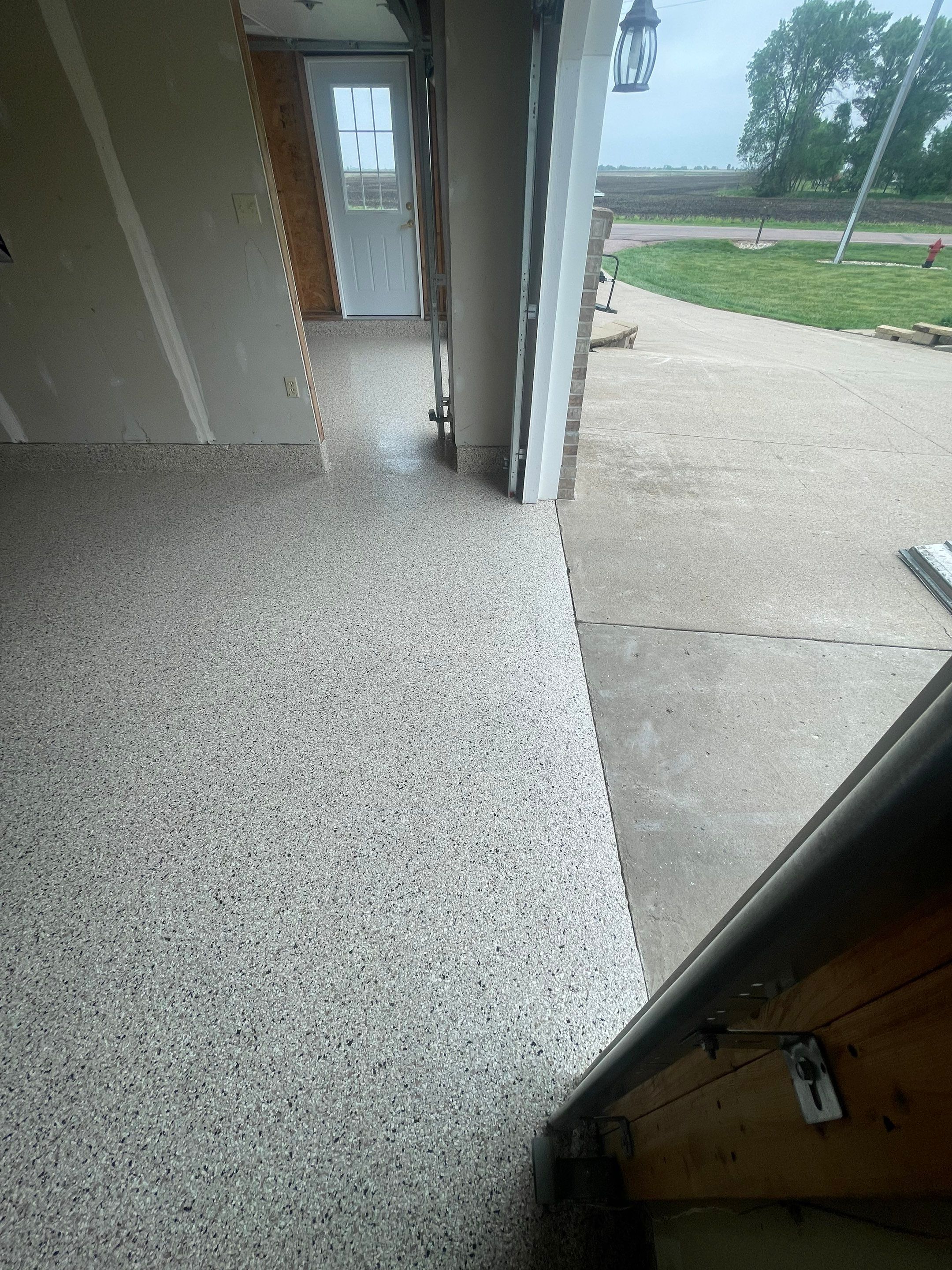 Speckled Epoxy Floor Coating Installation for Centerville Residential Garage by Select Painting, Coatings & Garage Cabinets
