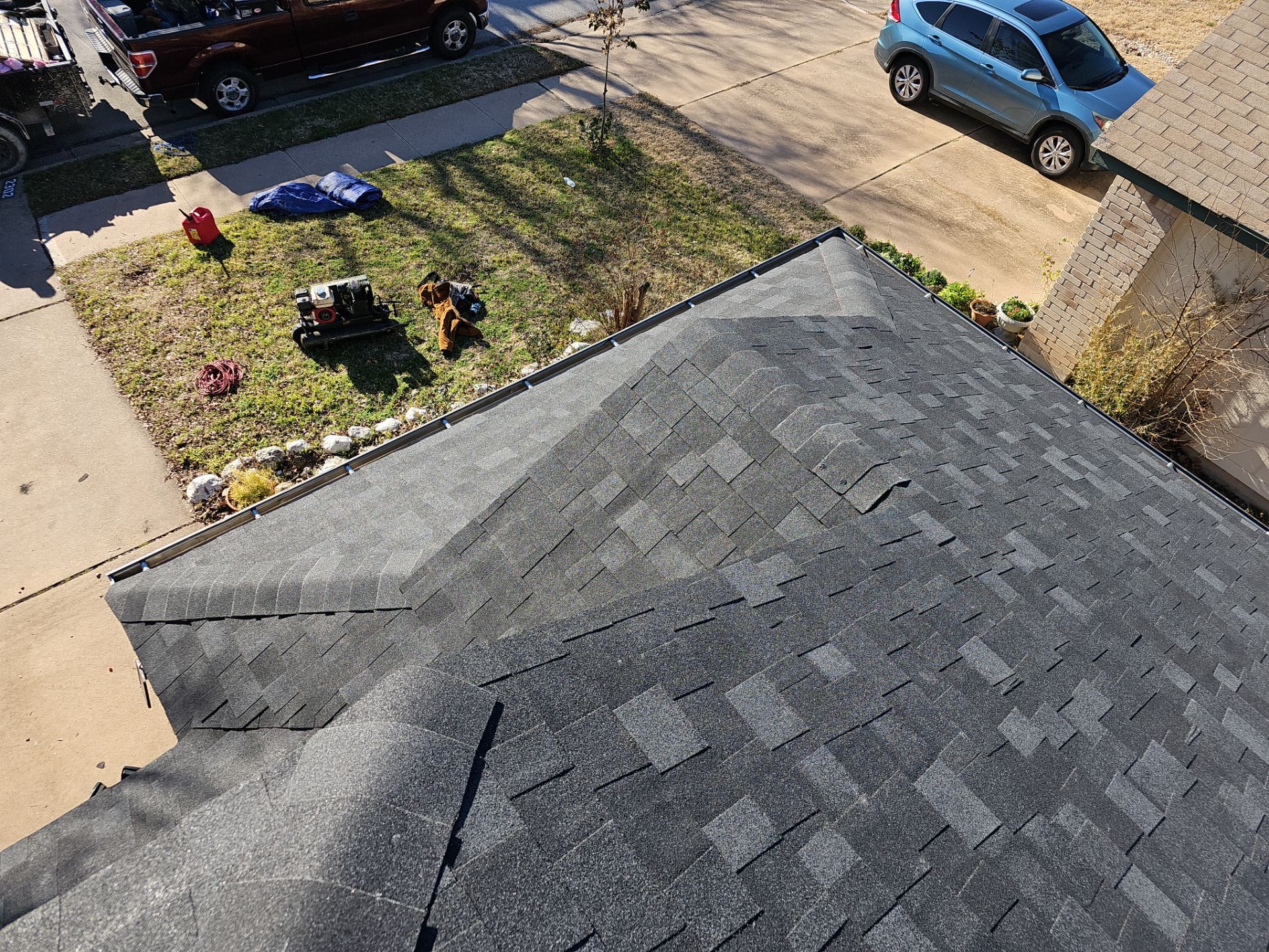 Residential Roofing Installation using Owens Corning Oakridge Onyx Black by DeZign Roofing & Exteriors