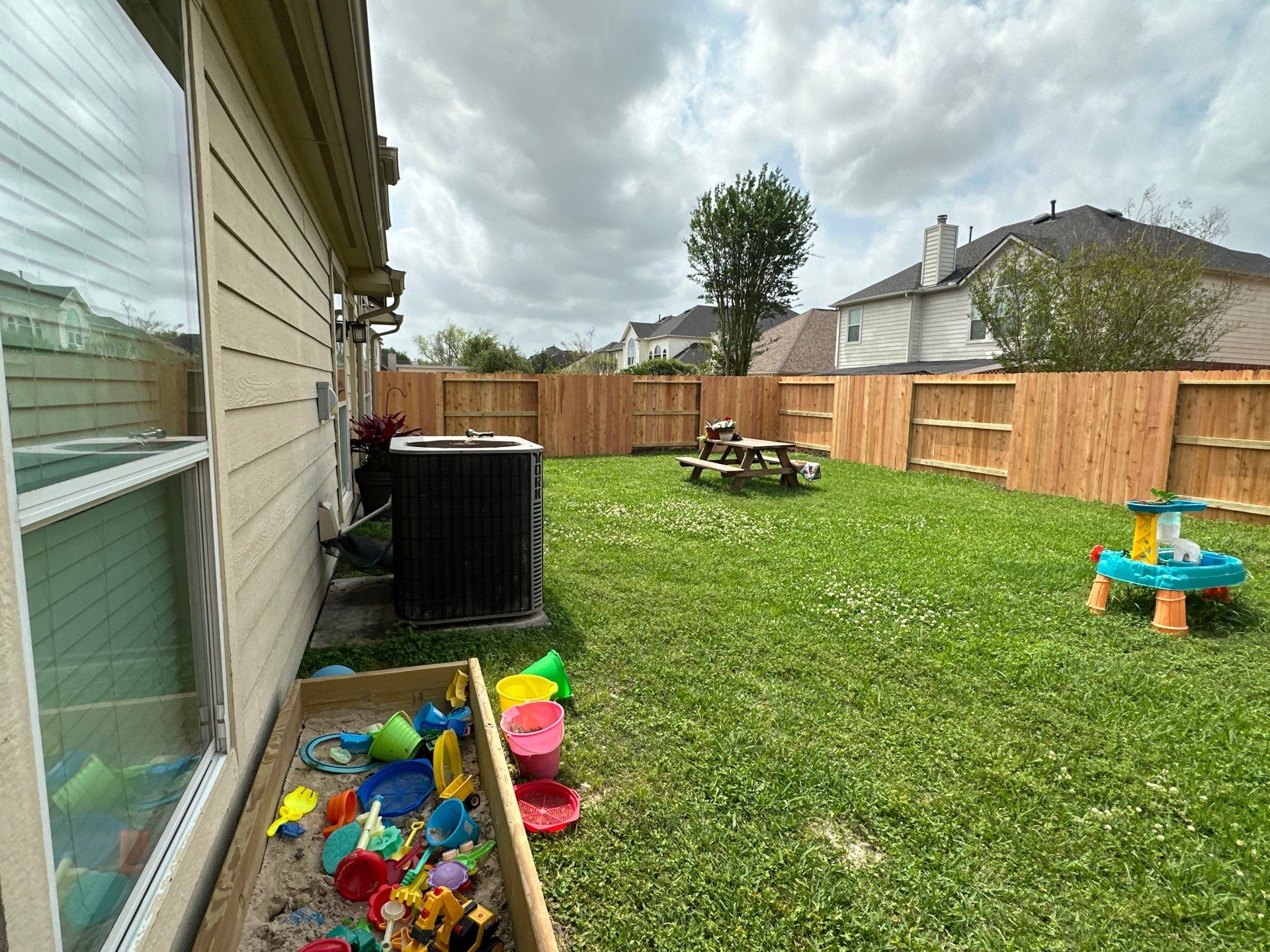 Wood fence with alternating panels by Tim's Fences