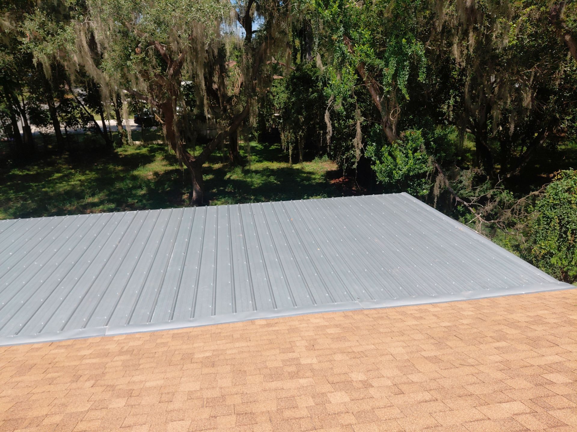 Combined Shingle and Metal Residential Roof Replacement in Leesburg Florida by Pinnacle Roofing Group