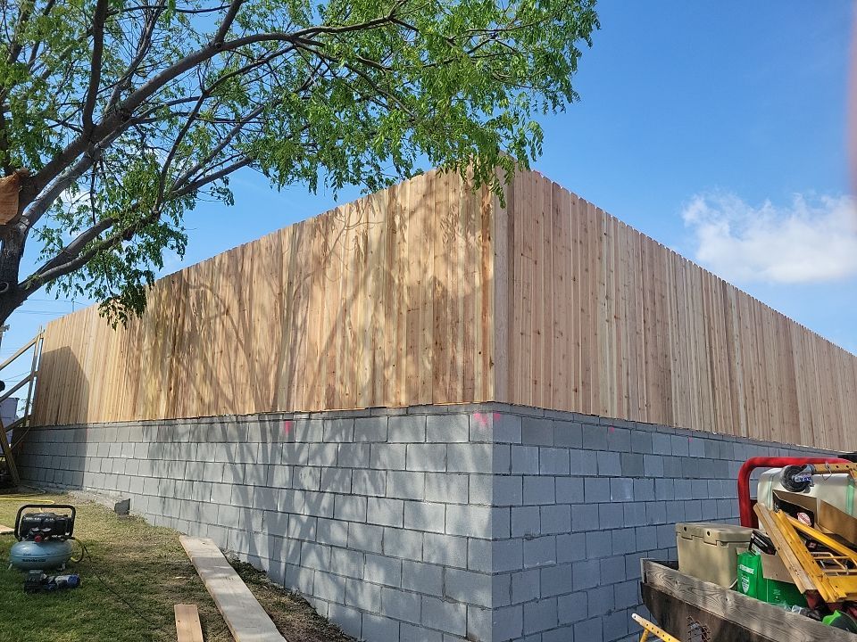 Cedar Fence using Cedar Pickets and Metal Poles by Clays Services Inc