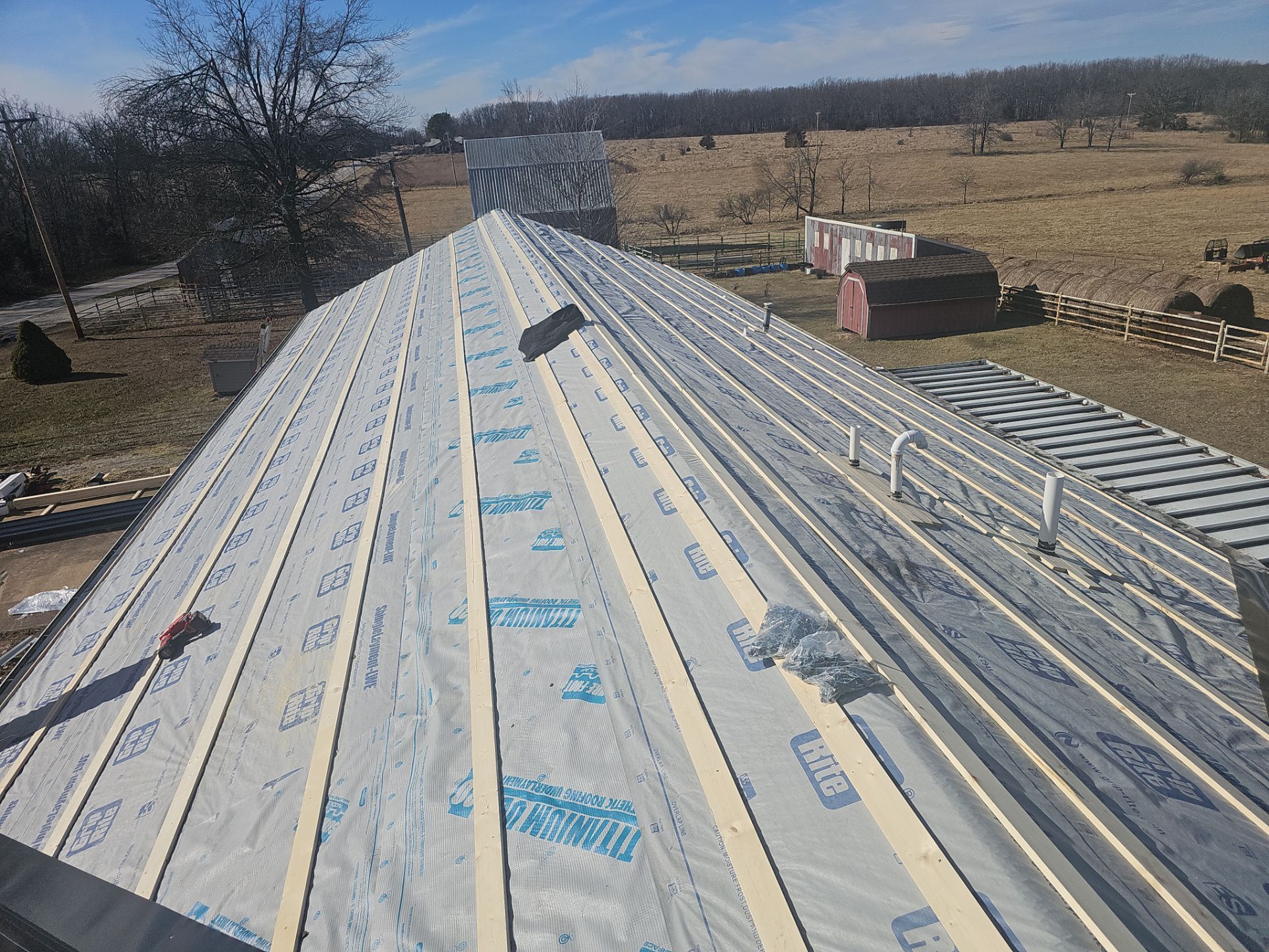 Residential 26 Gauge M-Rib Metal Roof + Gutters, Downspouts & Gutter Covers Install  by Titan Commercial & Residential Roofing 