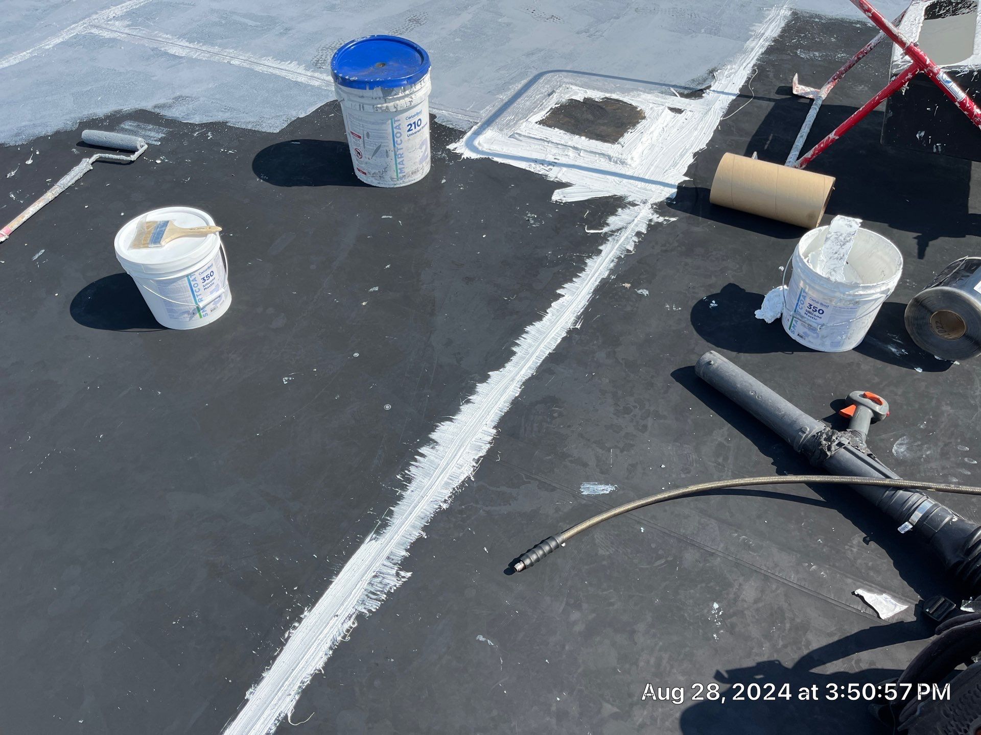 Commercial Roofing Installation using smartcoat Roof coating by Fahey Roofing + Contracting