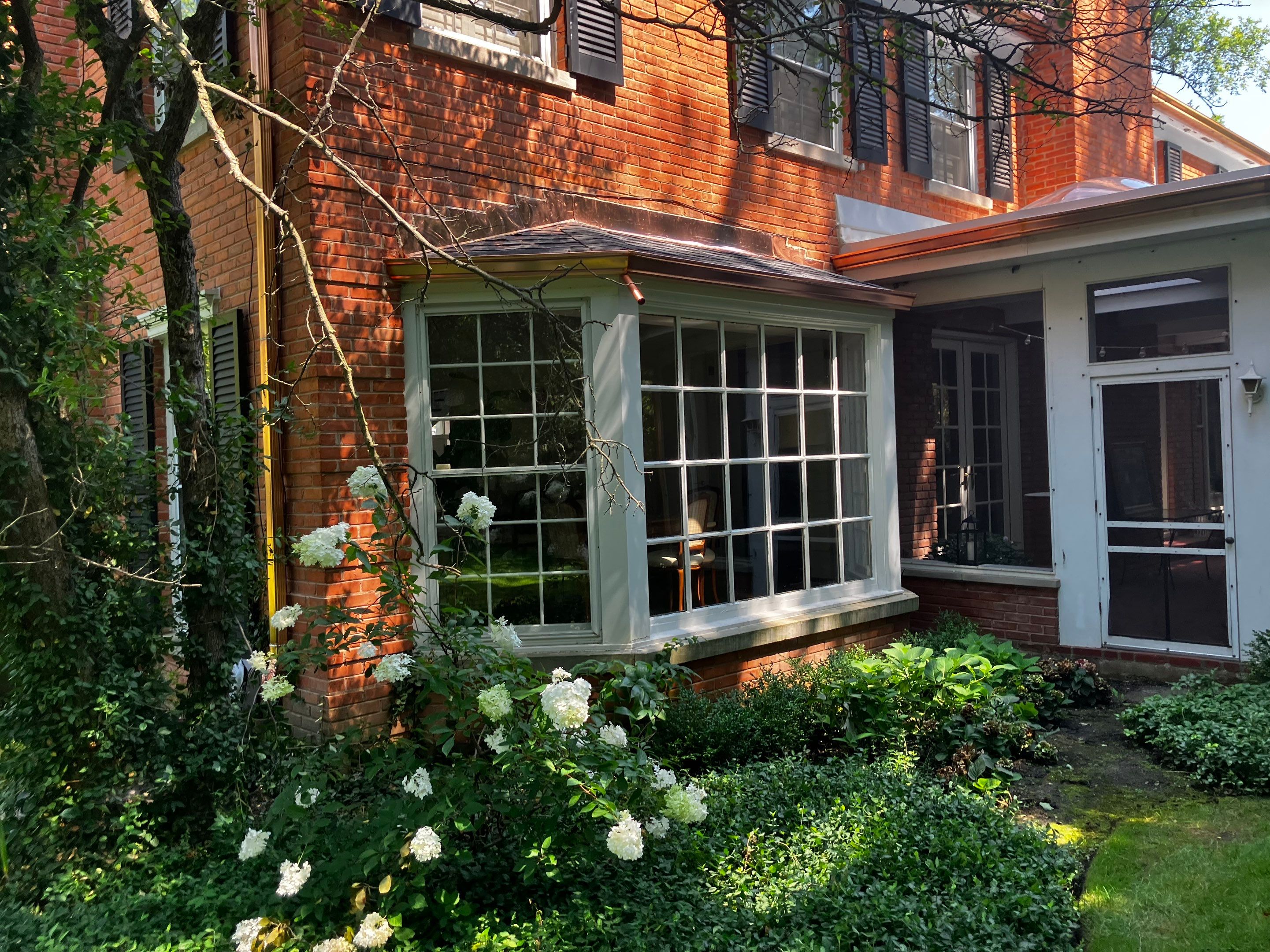Flat Roof Replacement and Copper Gutter Installation by Custom Installations