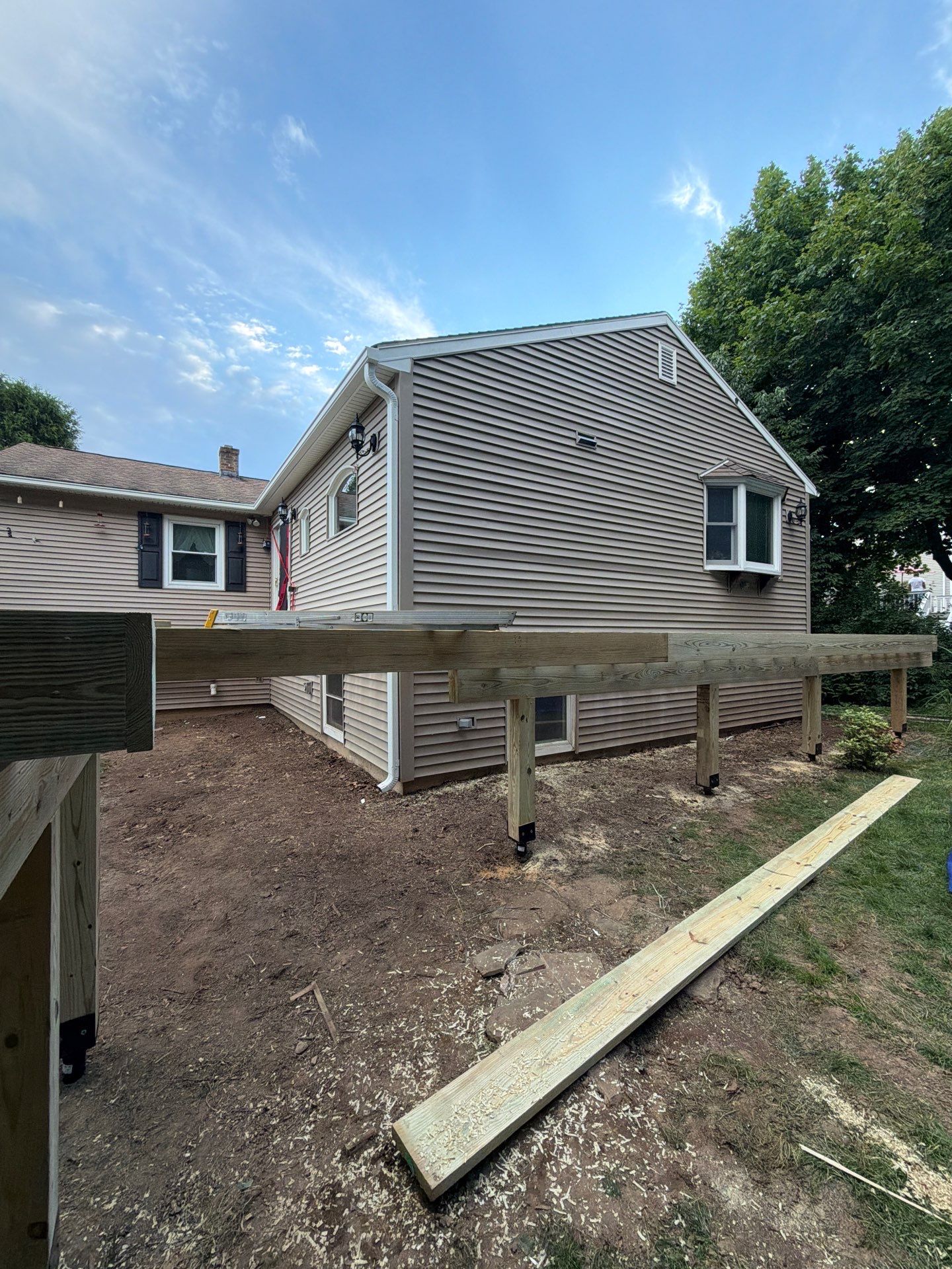 Deck Replacement using Trex Tropical Spiced Rum decking and Transcend White Railing by DiGiorgi Roofing and Siding Inc