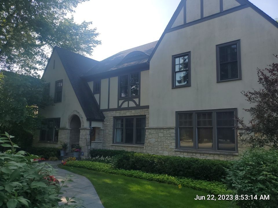 Northbrook, IL stucco home soft wash and stone cleaning by Northern Power Washing LLC.