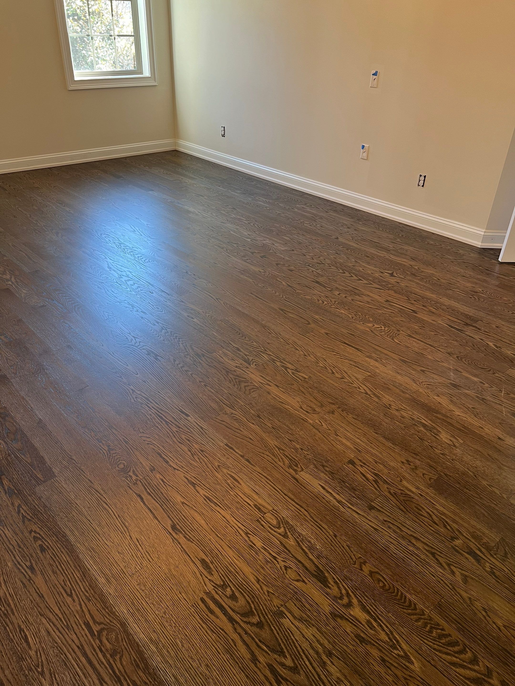 Adding hardwood floors to bedrooms by Accent Custom Floors