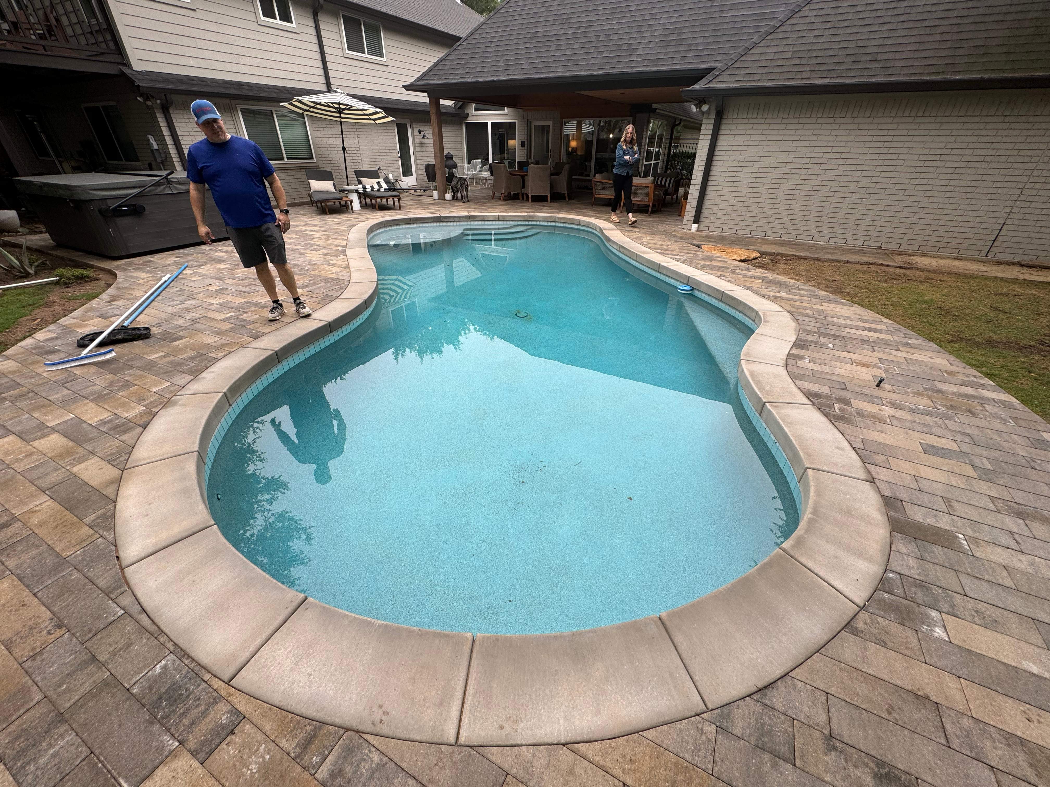 Freeform Pool with Raised Spa and Natural Stone Deck by Pinnacle Pools and Spas - DFW