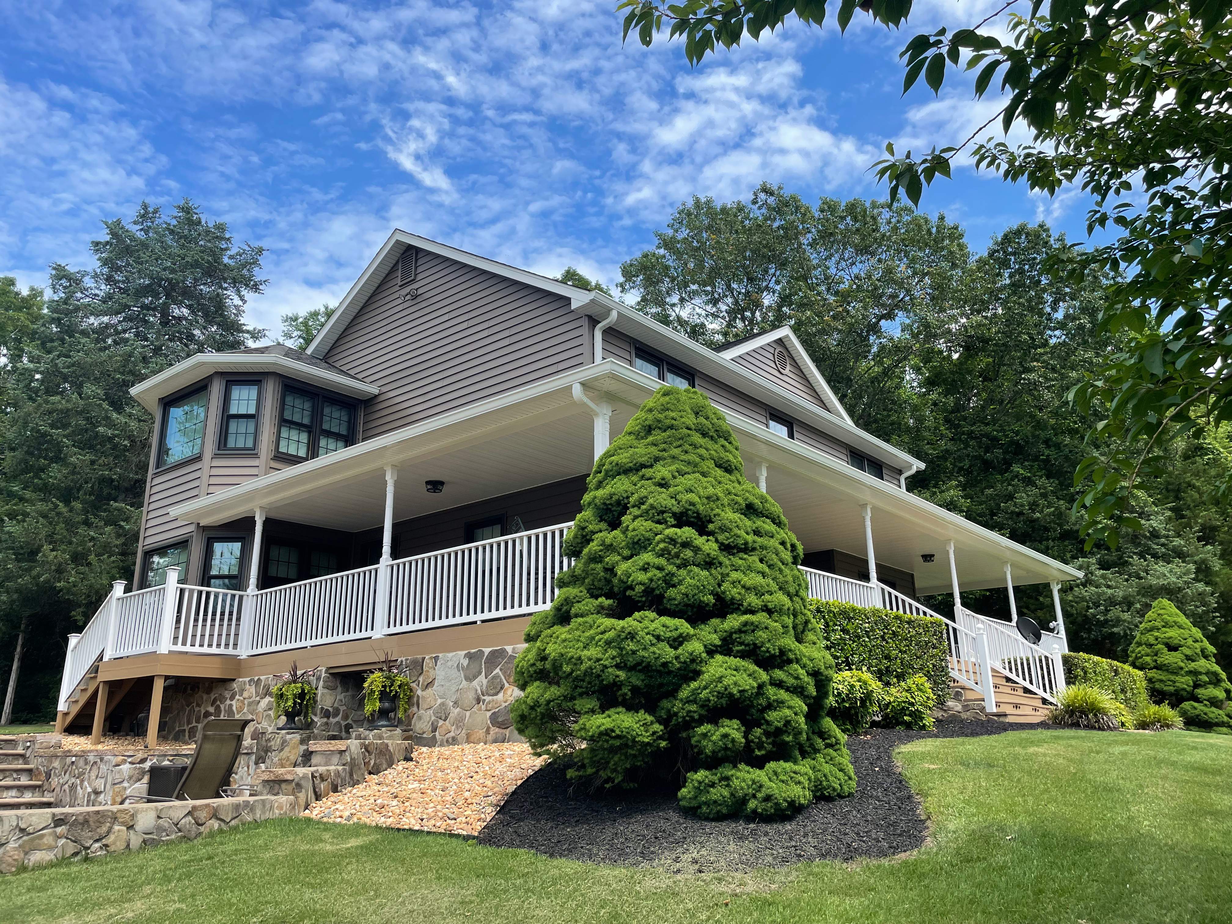 Exterior remodel including window replacement by American Home Contractors