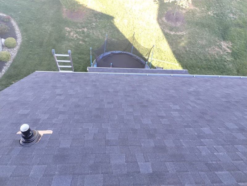 Residential Roofing Installation using Atlas Pinnacle Pristine Black Architectural Shingles by Frederick Roof Repair