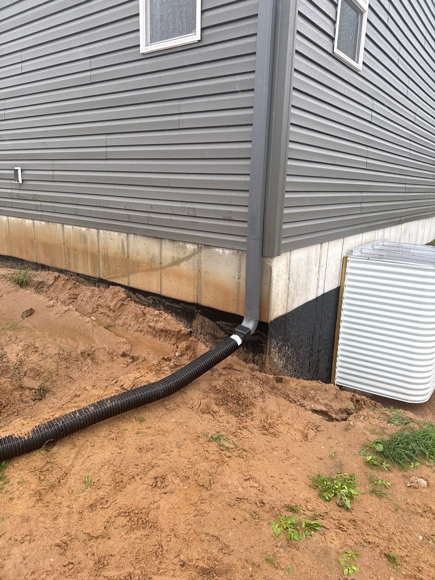 Gutter and Downspout System Installation for Manistee Residential Property by Rainbow Seamless Systems