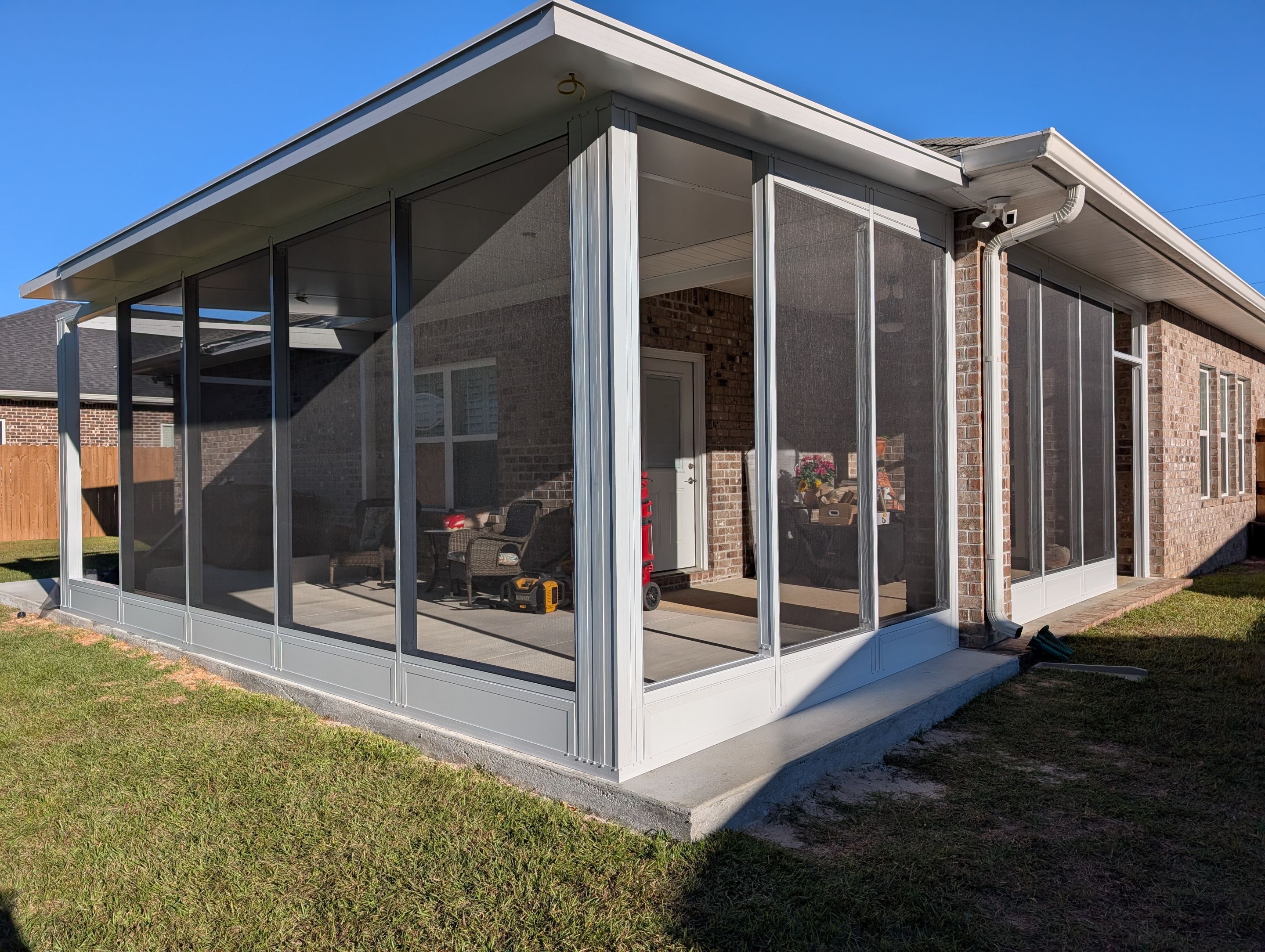 Home addition w/Vinyl 4-Track Windows by Titan Sunrooms