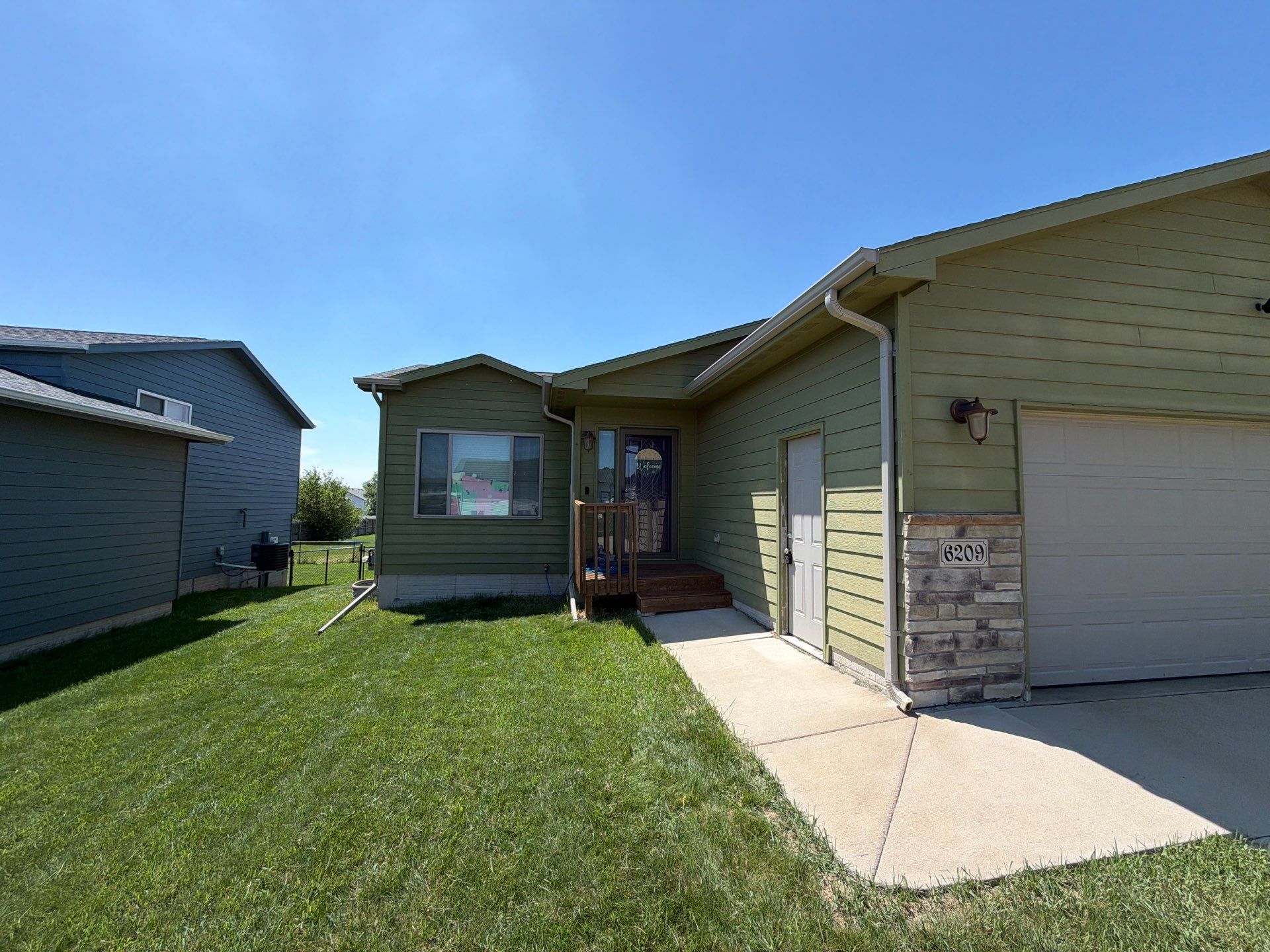 Exterior Painting and Custom Deck Construction in Sioux Falls by Select Painting, Coatings & Garage Cabinets