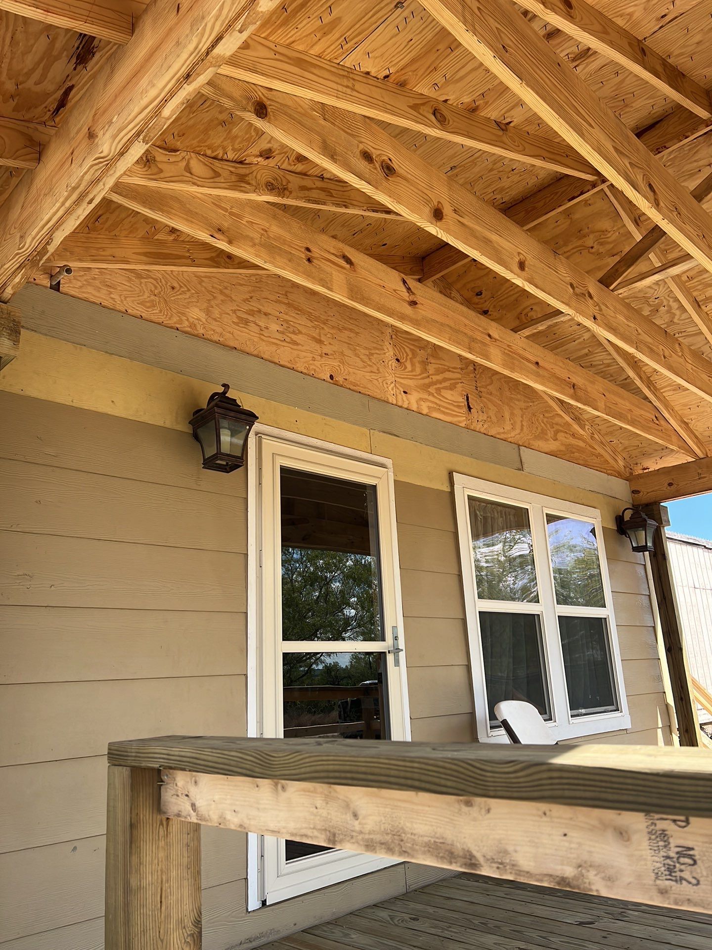 Front Porch Sitt'n by Bayfront Roofing and Construction