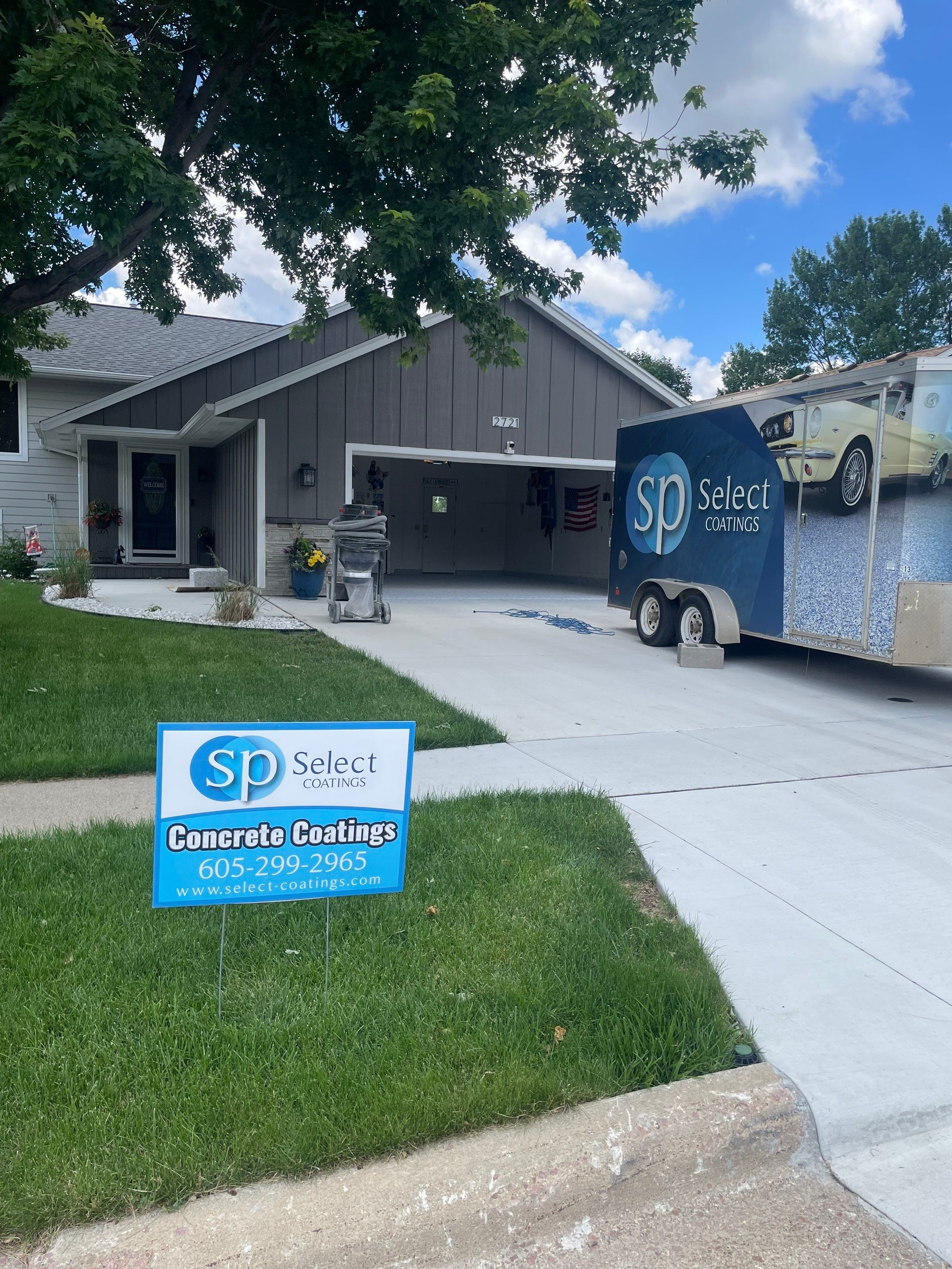 Residential Garage Floor Coating with Feather Grey Finish in Sioux Falls by Select Painting, Coatings & Garage Cabinets
