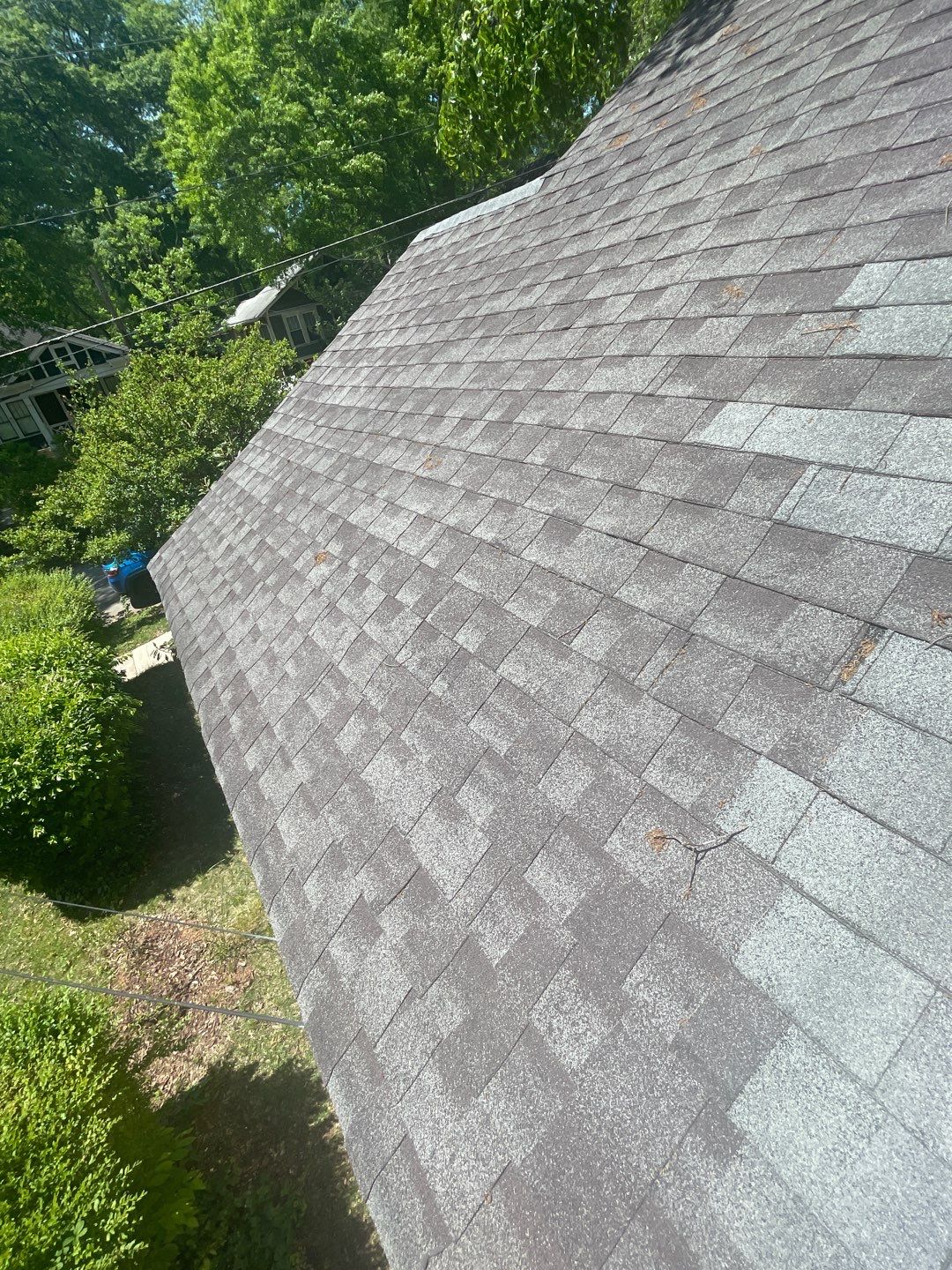 roof replacement and new black gutters by Nailed It Roofing & Remodeling LLC