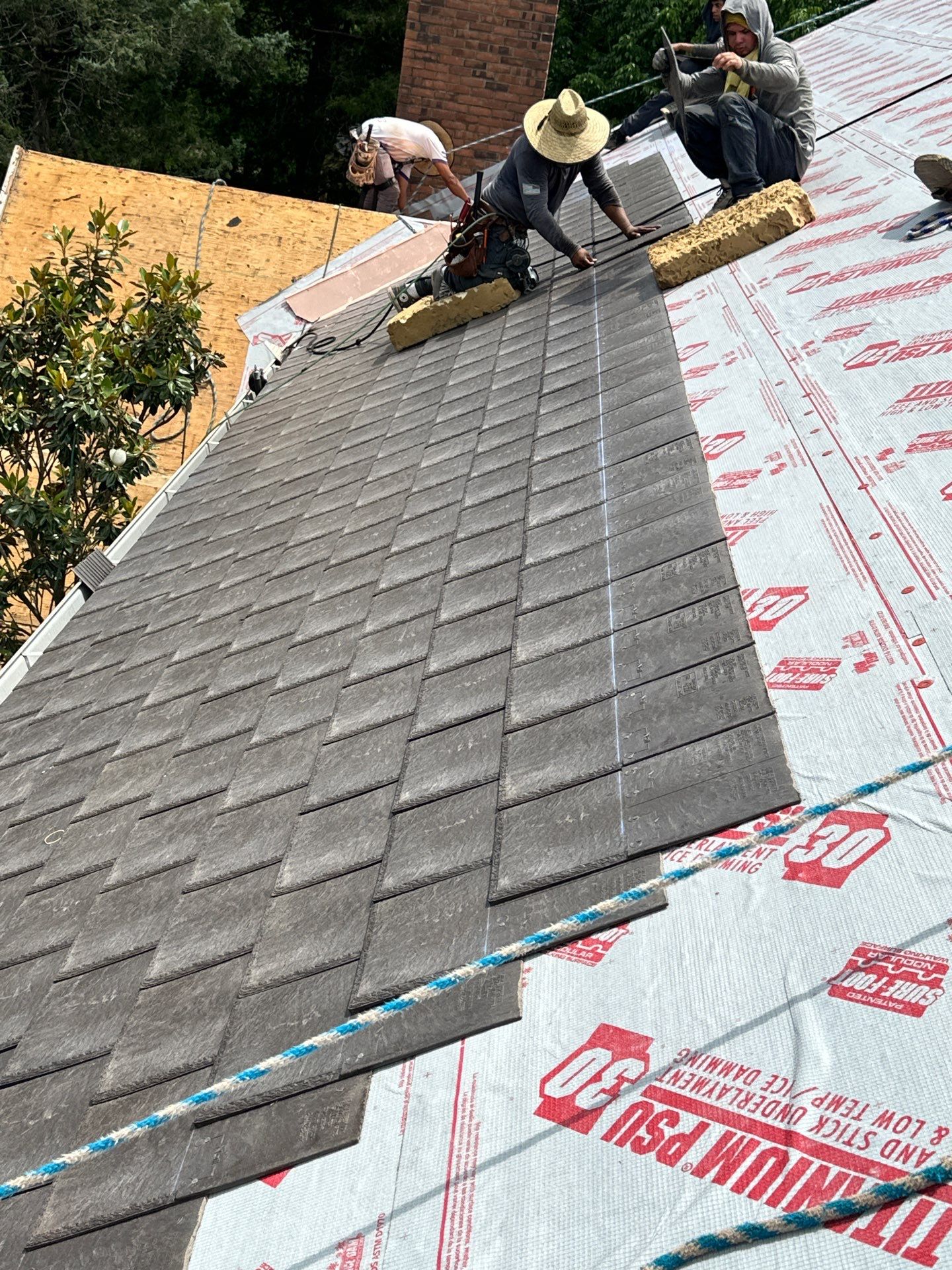 Residential Roofing Installation Using Enviroshake Synthetic Slate by Undersun Roofing 