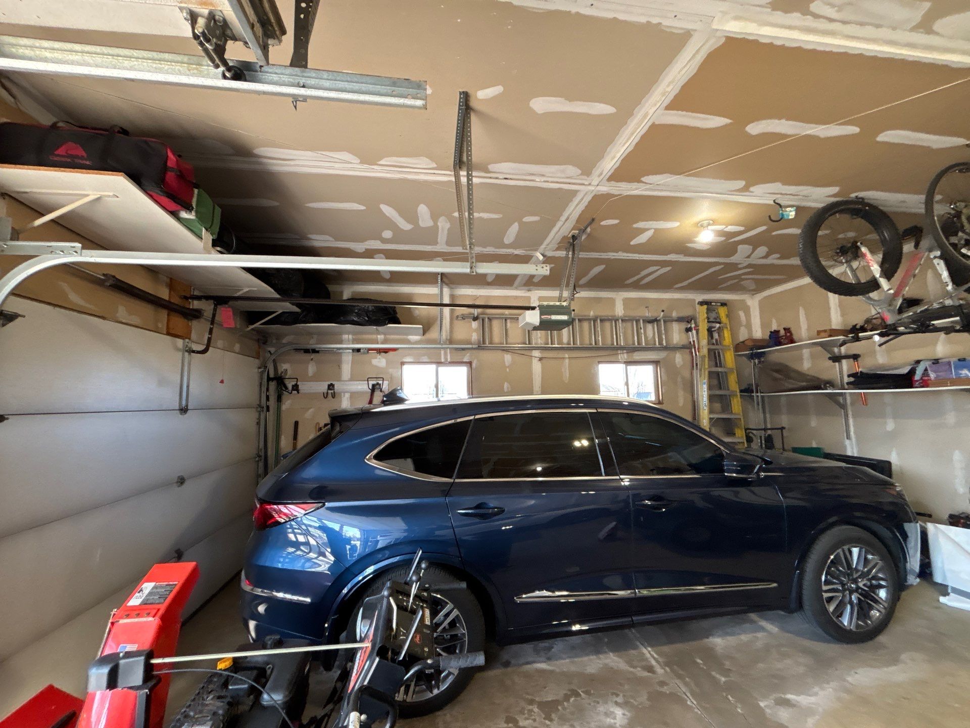Sioux Falls Garage Concrete Repair and Epoxy Flake Floor Coating by Select Painting, Coatings & Garage Cabinets