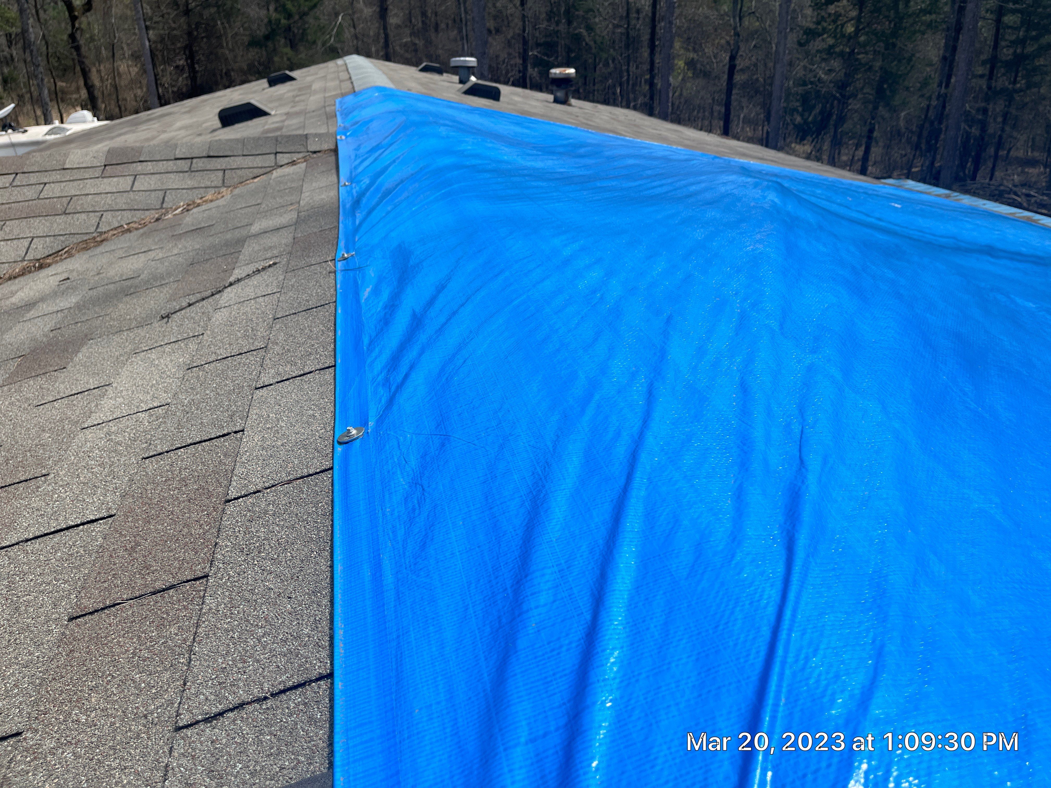 Residential Roofing Installation using 26 Gauge Colored Panels by Hostetler Roofing