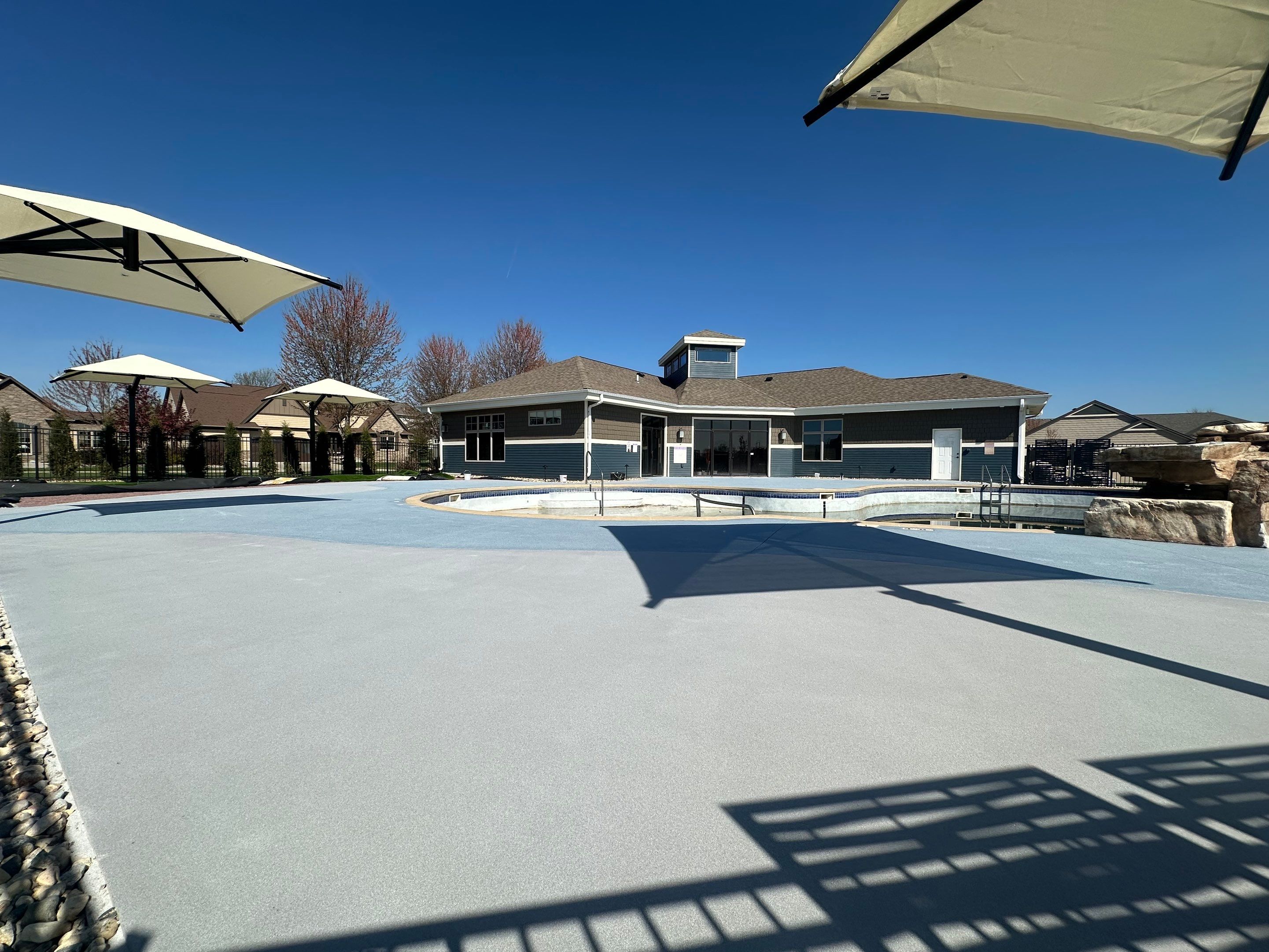 Arbors Edge Pool Deck Restoration and Textured Concrete Coating by Select Painting, Coatings & Garage Cabinets
