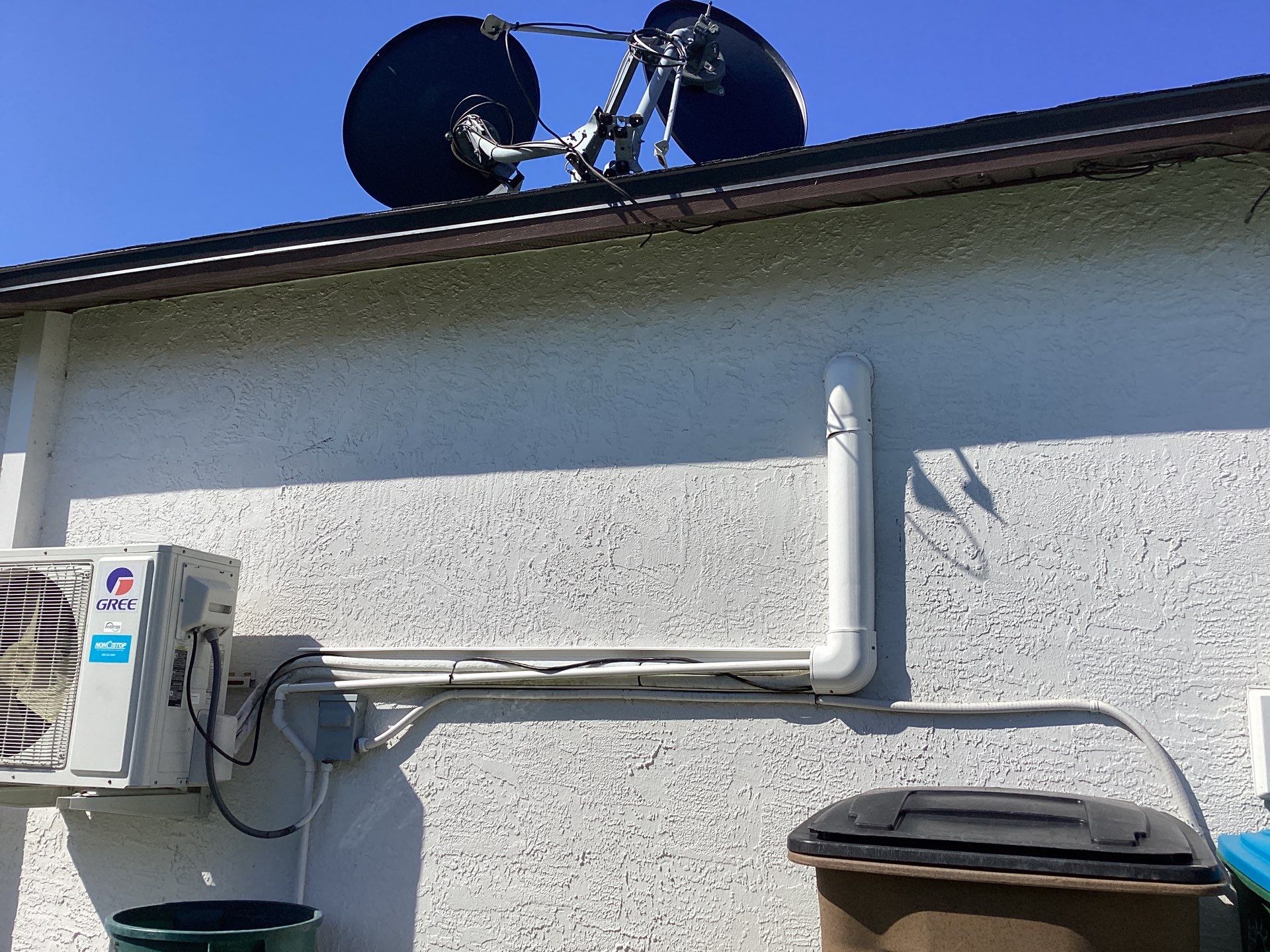 Brown Gutter + White and Brown Downspouts in Cape Coral FL by Gutter Professors