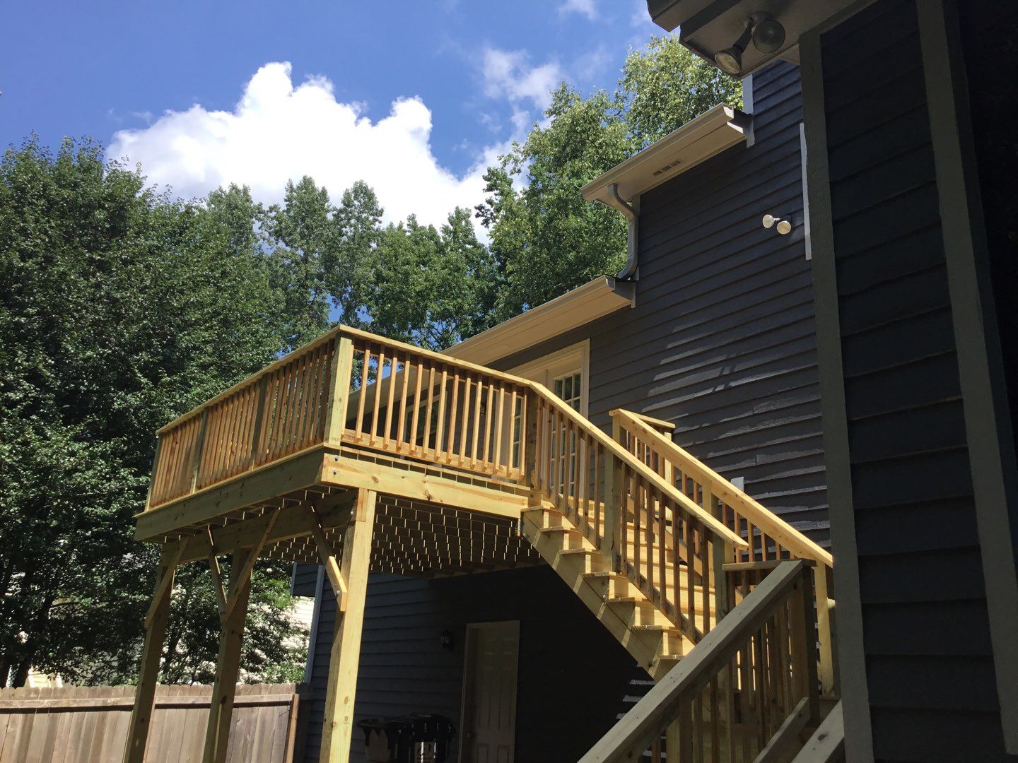 Elevated Wooden Deck and Front Porch Renovation in Marietta by Swift Home Renovations 