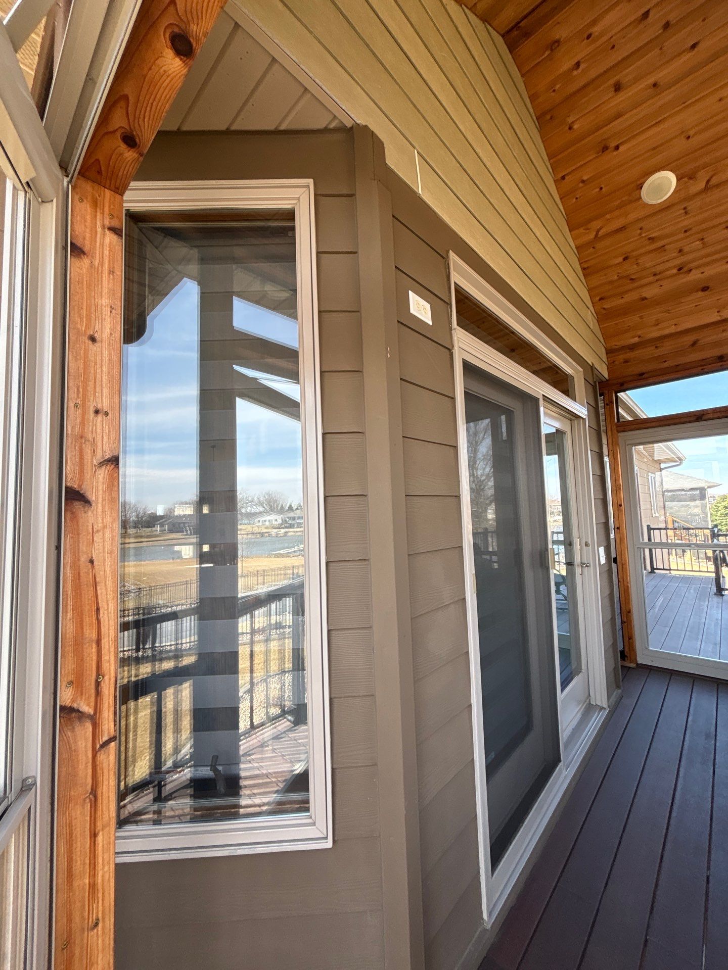 Full Exterior Renovation with Stone Veneer and Composite Decking by Select Painting, Coatings & Garage Cabinets