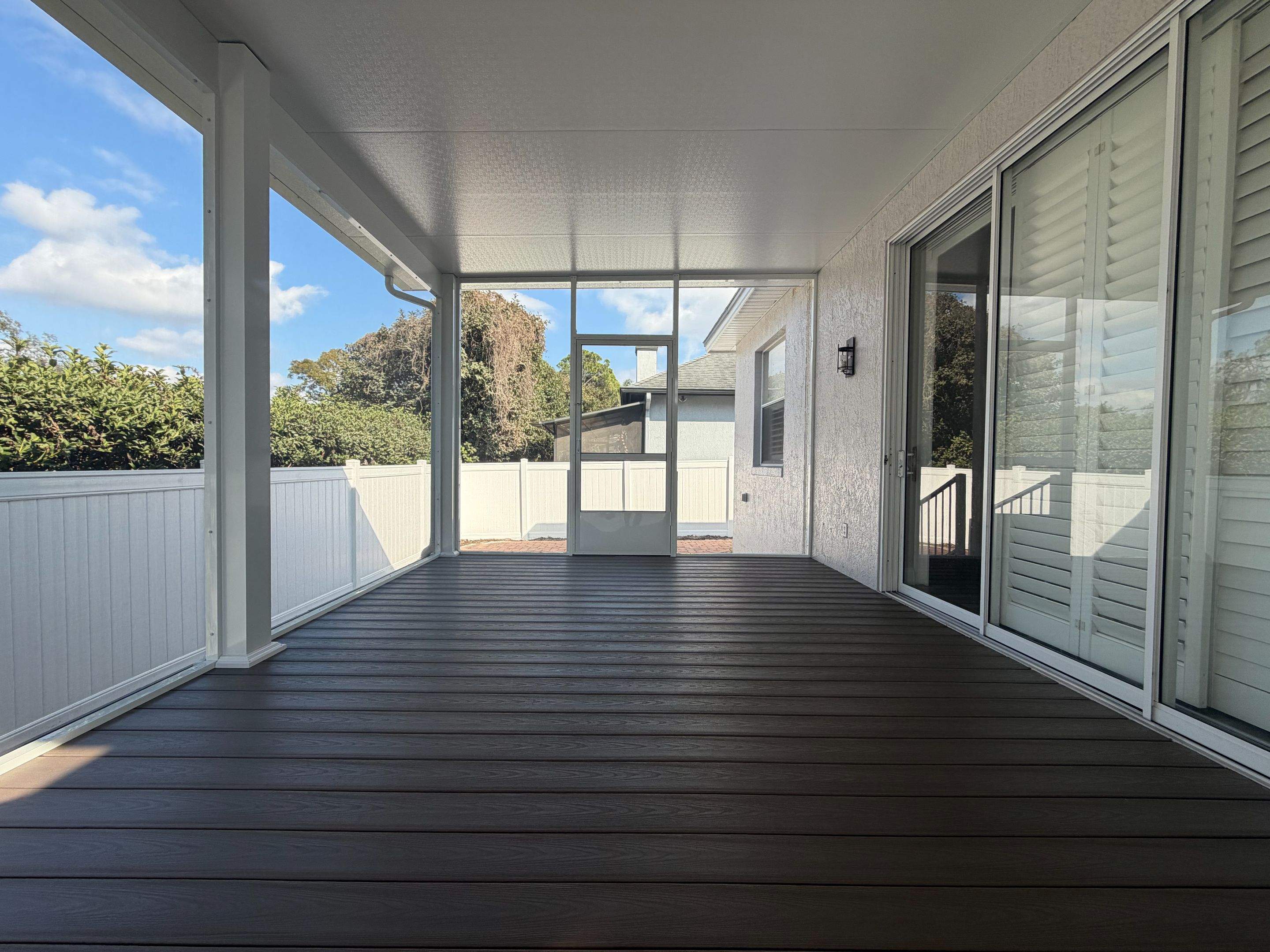 The Complete Backyard Retreat: Insulated Screen Room & Composite Deck by Orlando pergolas