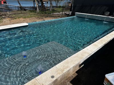 Lakefront Geometric Pool with Tanning Ledge
