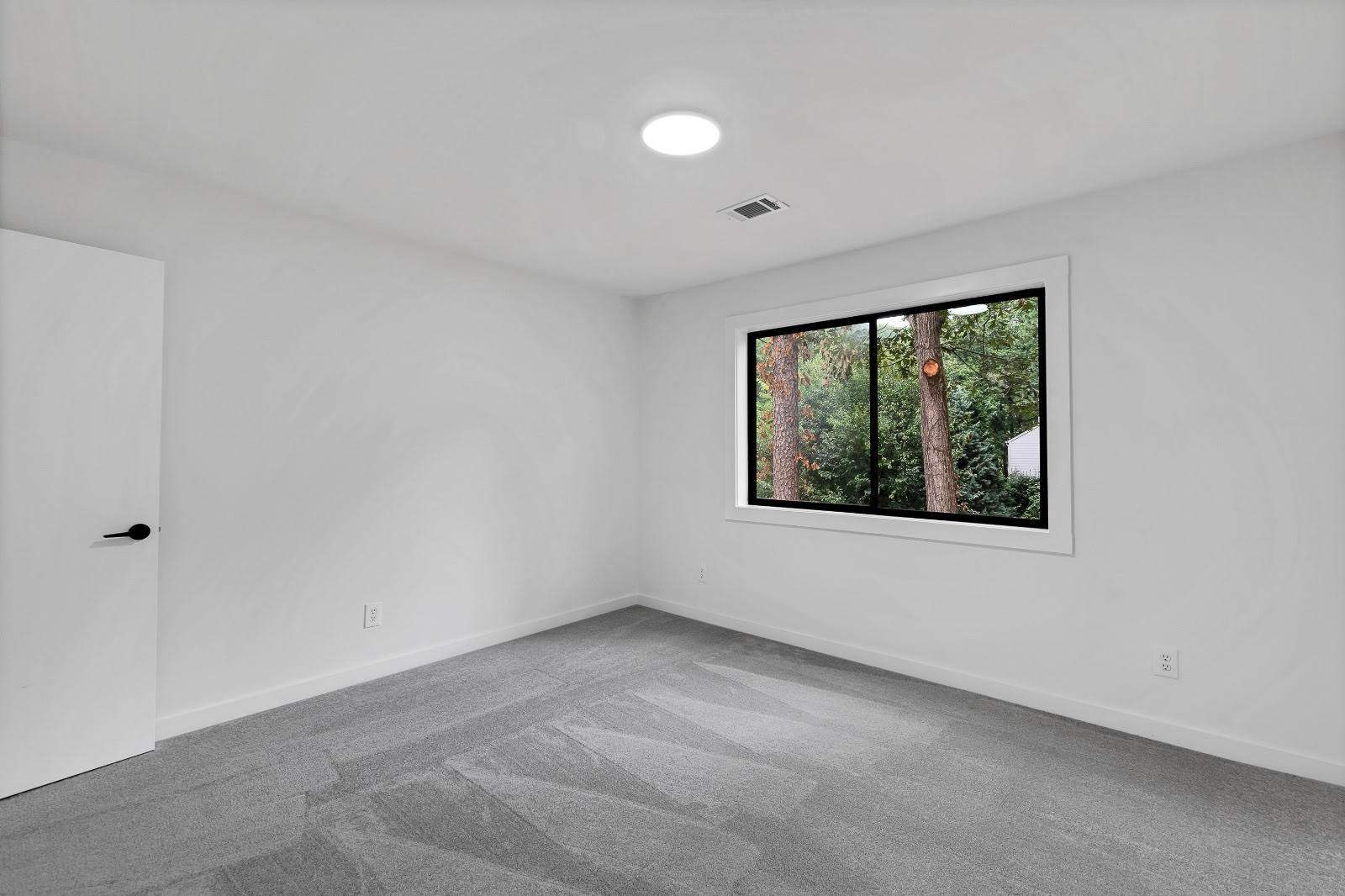 Modern Marietta Home Transformation with Custom Kitchen and Vertical Siding by Swift Home Renovations