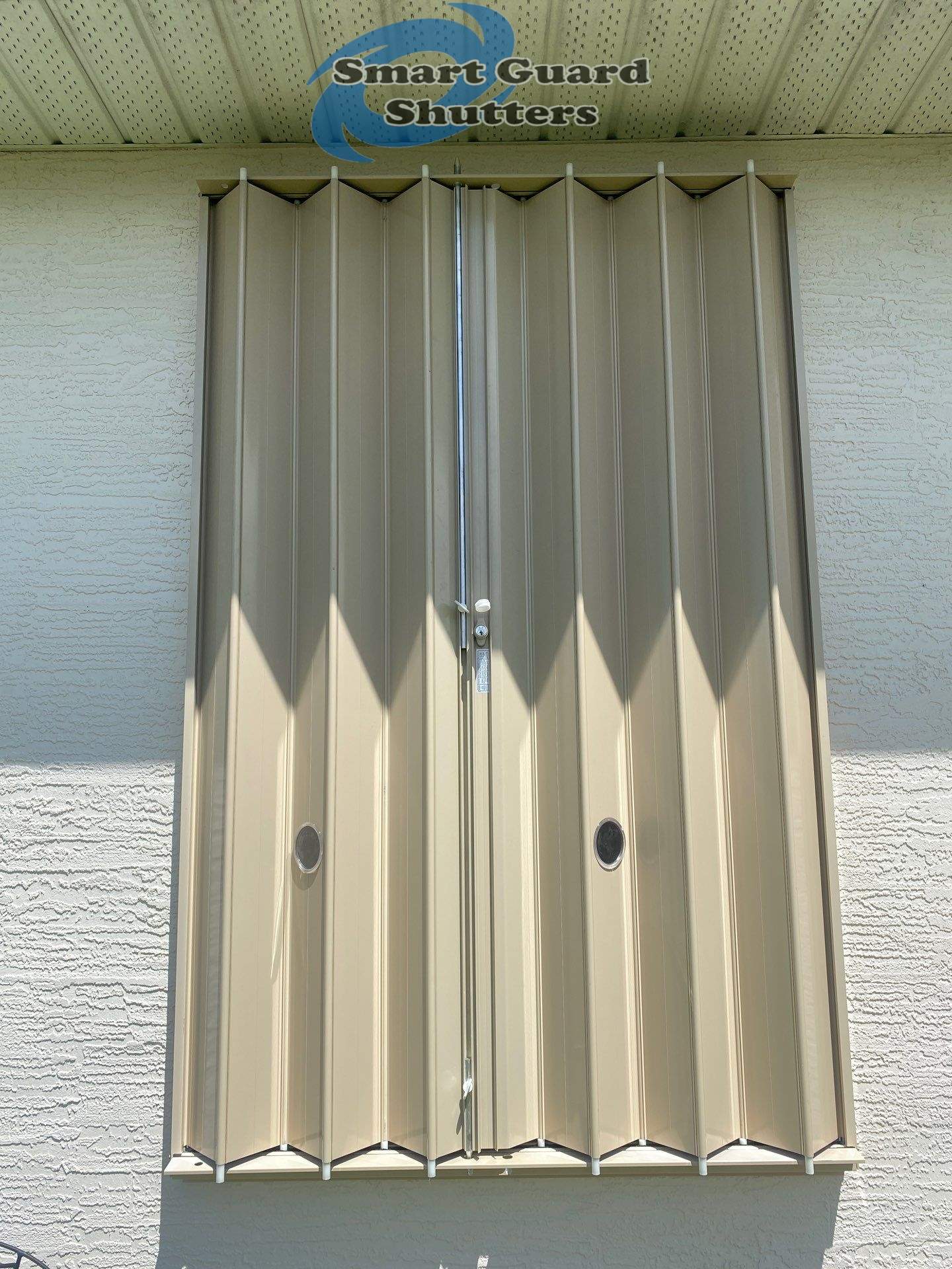 Accordion Shutters in Beige  by Smart Guard Shutters