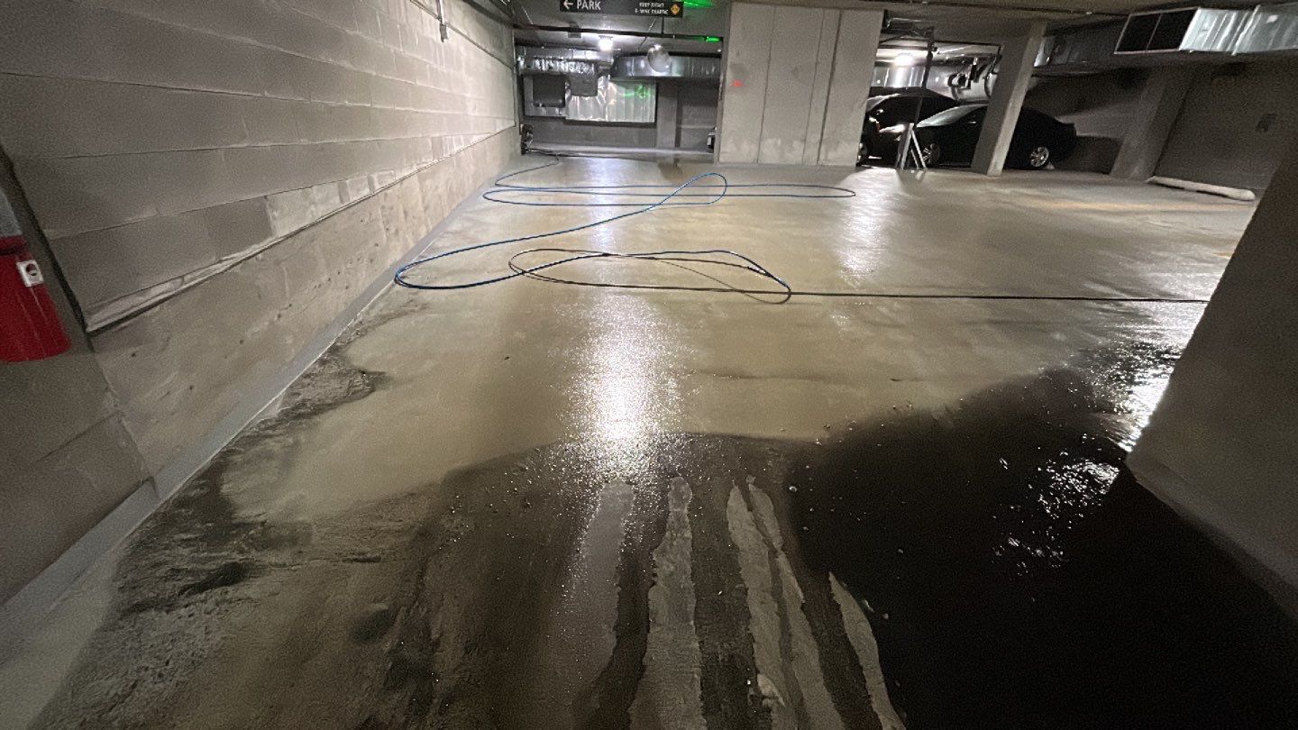 Parking garage using Hot water by Northern Power Washing LLC.