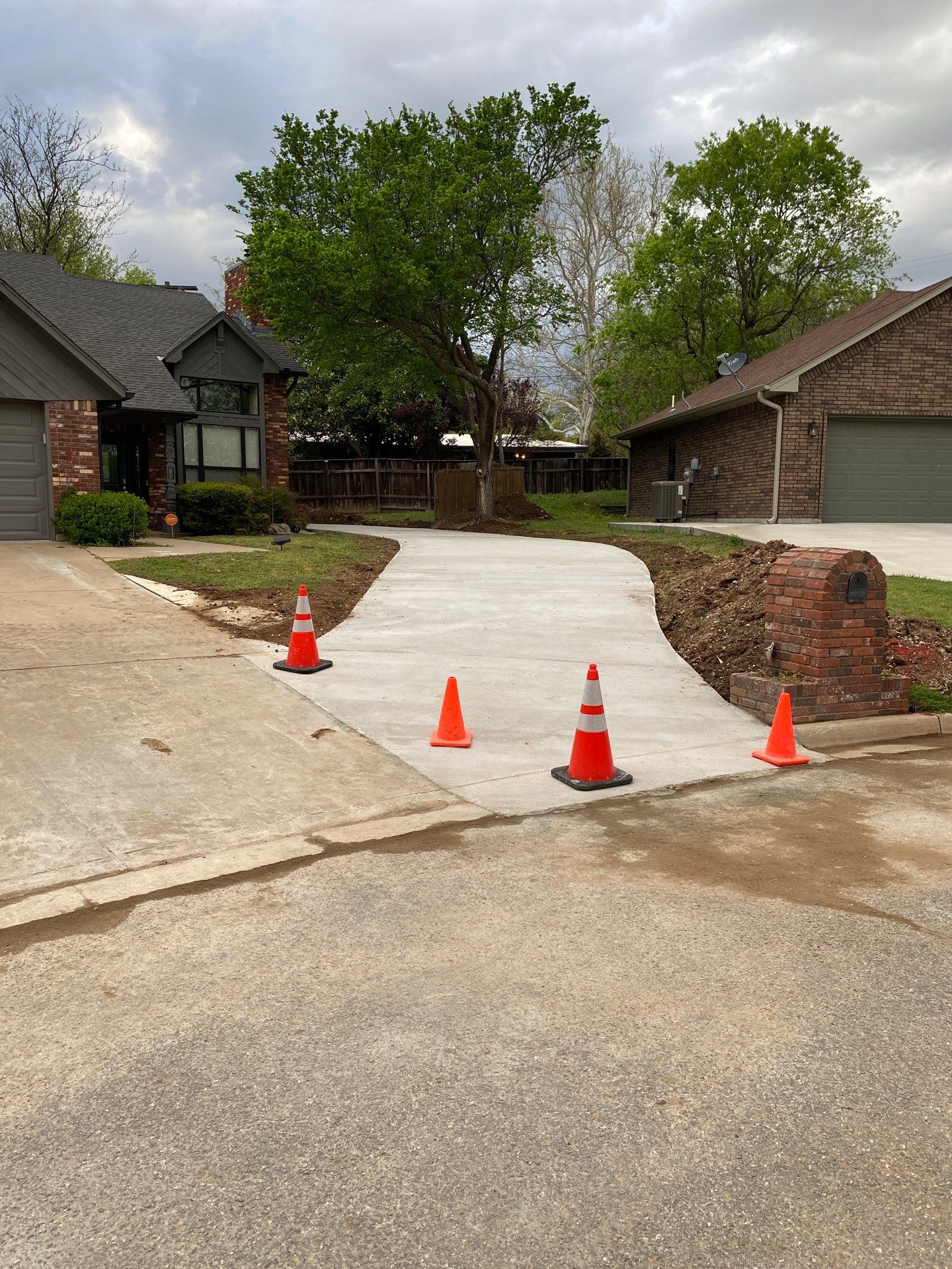 Concrete Driveway and Fence by Clays Services Inc