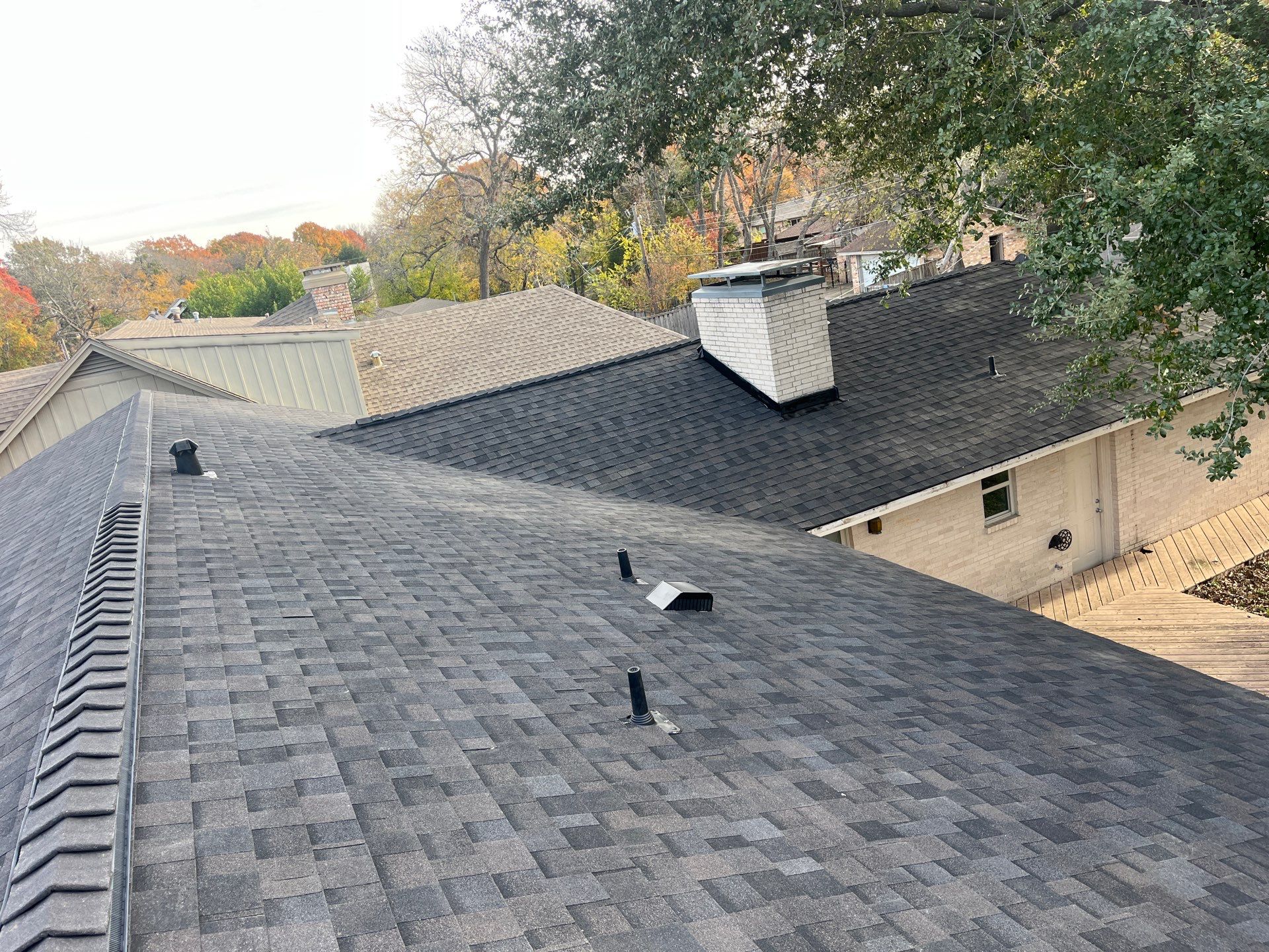 IKO Brownstone- White Brick  by Tejas Roofworks + Restoration