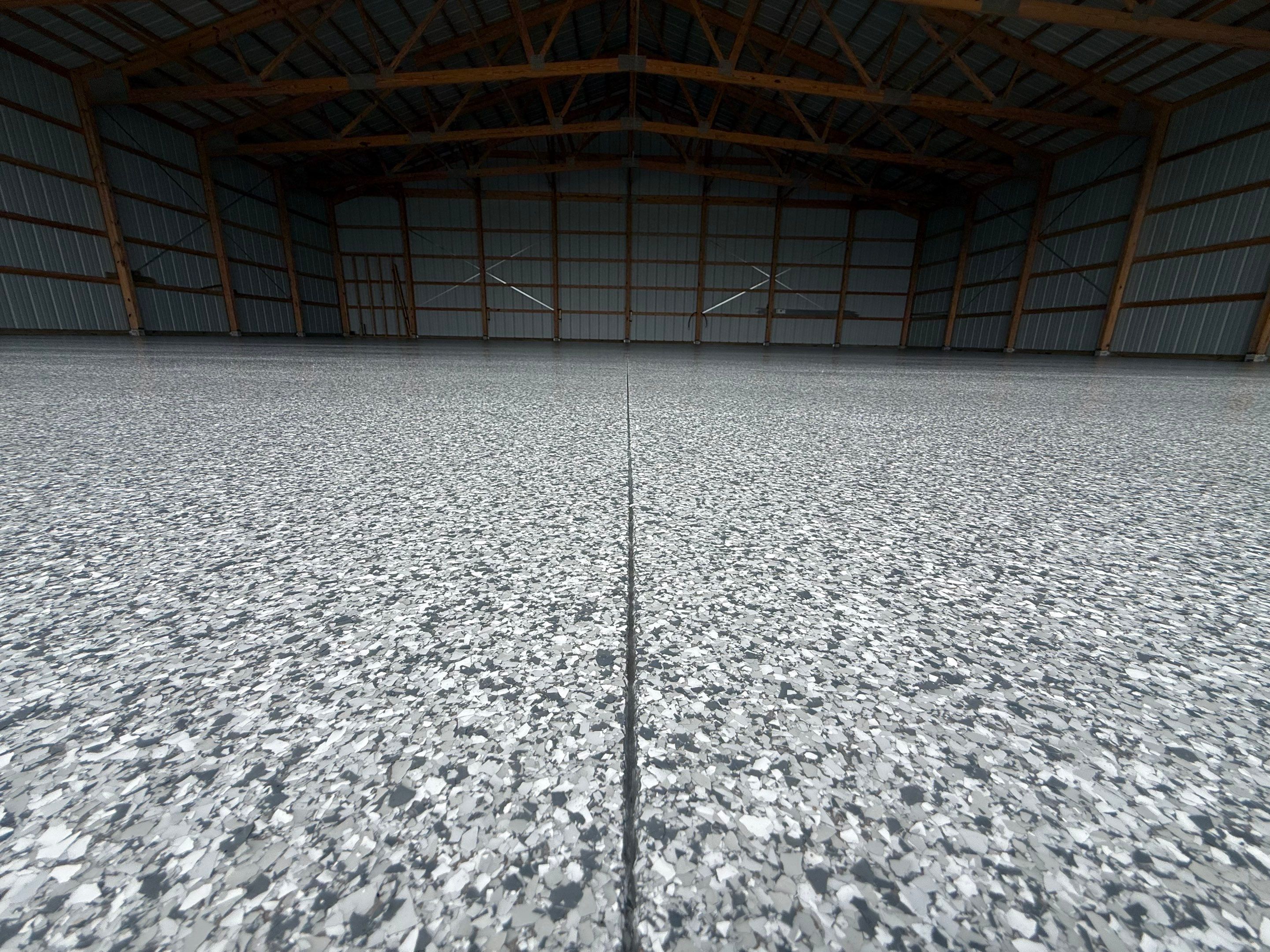 Durable Grey Speckled Epoxy Floor Coating for Yankton Shop by Select Painting, Coatings & Garage Cabinets