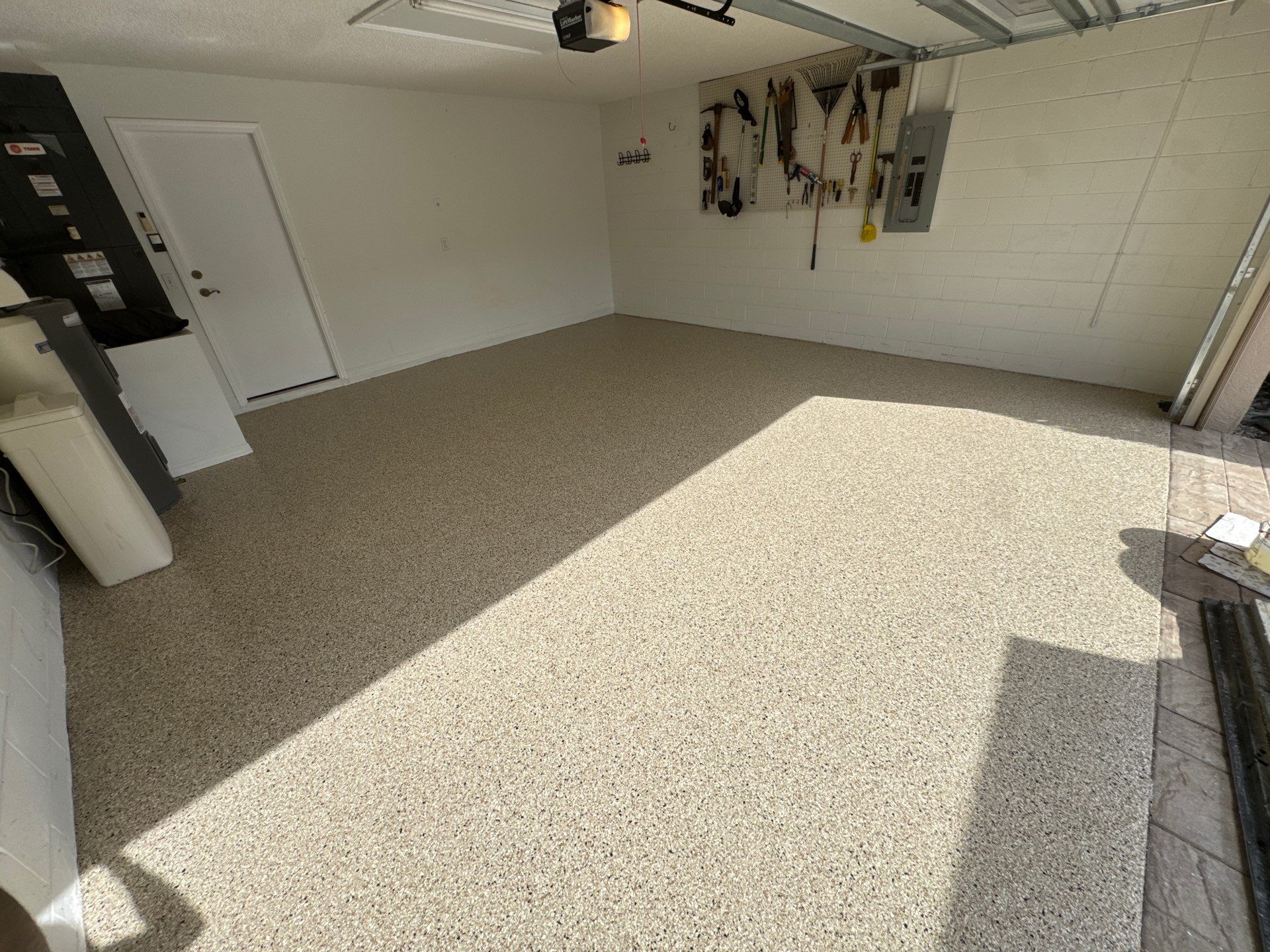 Shoreline Flake Garage with High-End Neutral Tones by Performance Floors & Coating