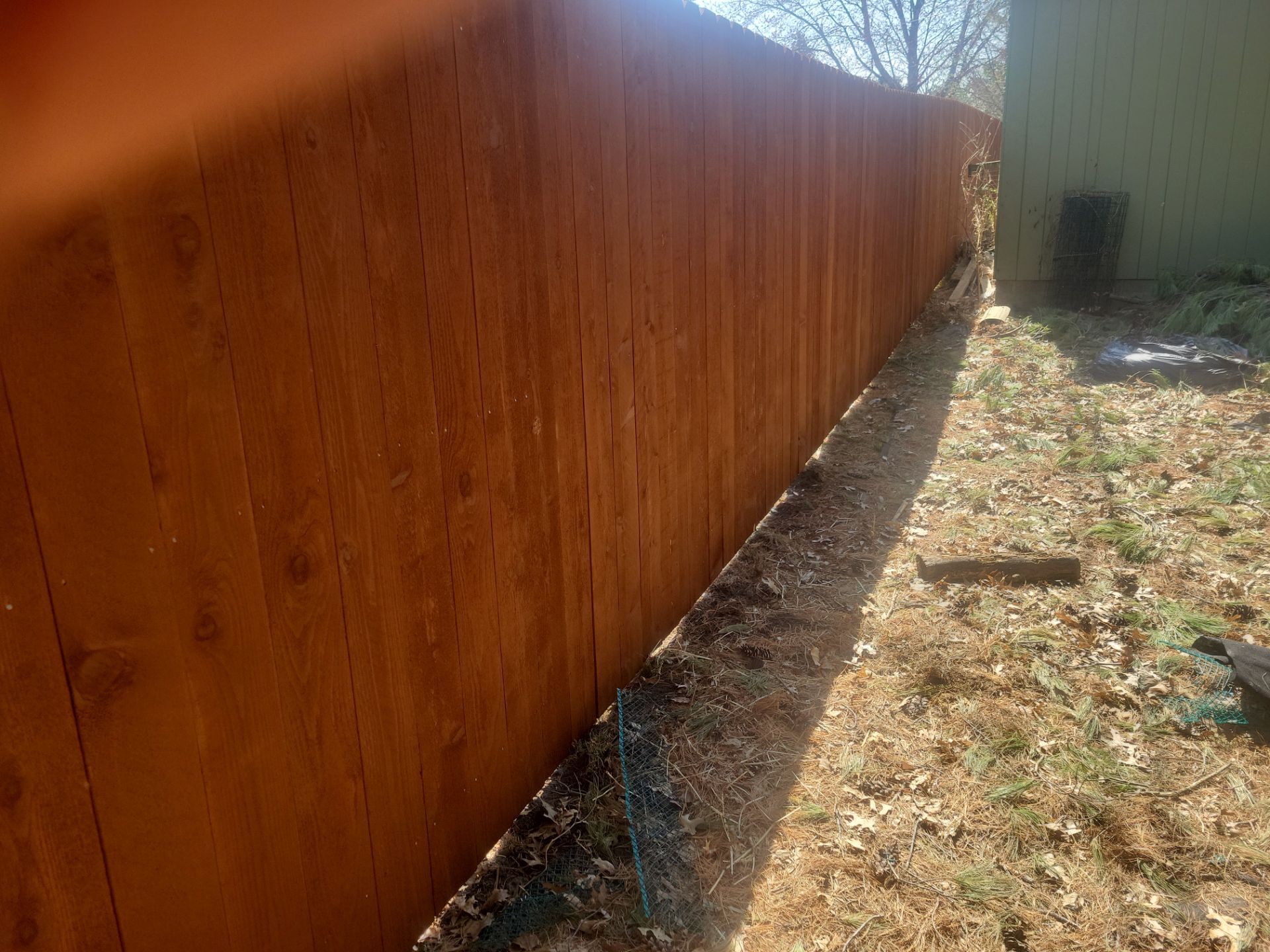 Stained Cedar Wood Privacy Fence Installation in Cedar Falls by Perfect Picket Fence and Stain