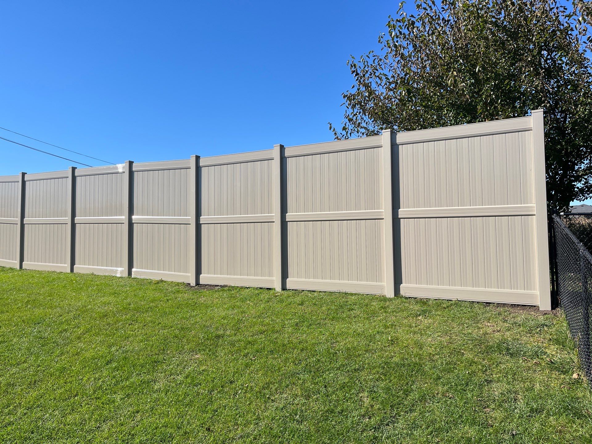 Adobe Vinyl Privacy Fence and Gate Installation in Cedar Falls by Perfect Picket Fence and Stain