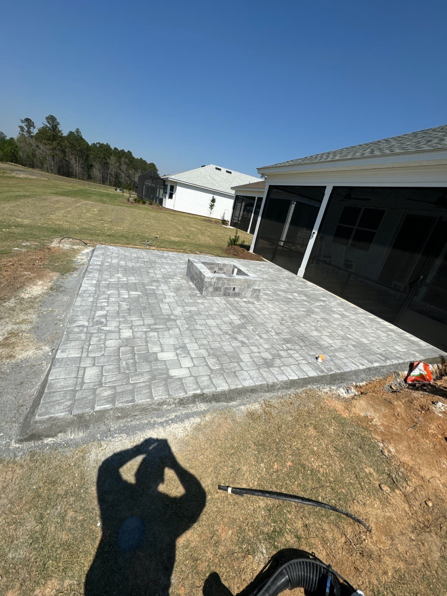 Custom Grey Paver Patio and Square Fire Pit in Hardeeville by Lowcountry Scapes, LLC