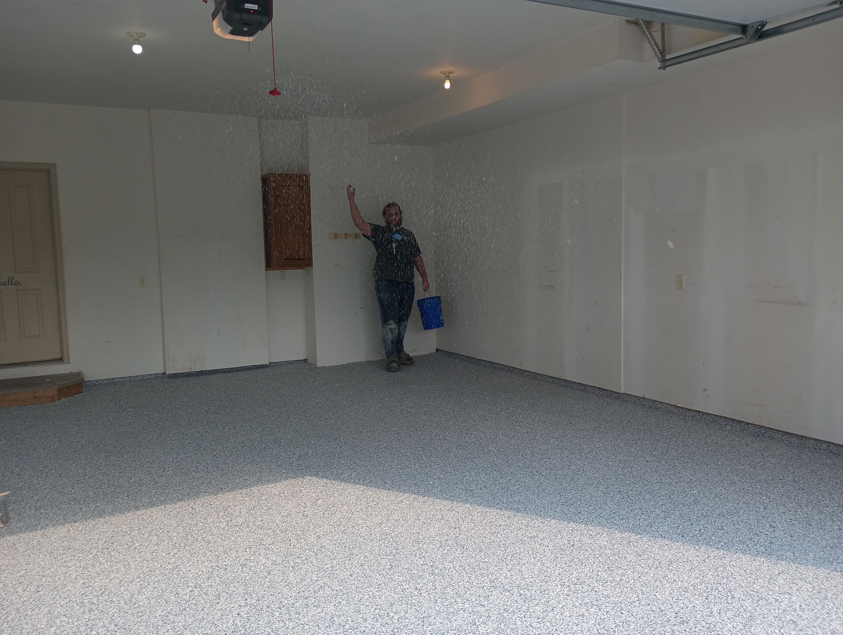 Garage Concrete Coating Installation in Sioux Falls Using Tidal Wave Finish by Select Painting, Coatings & Garage Cabinets