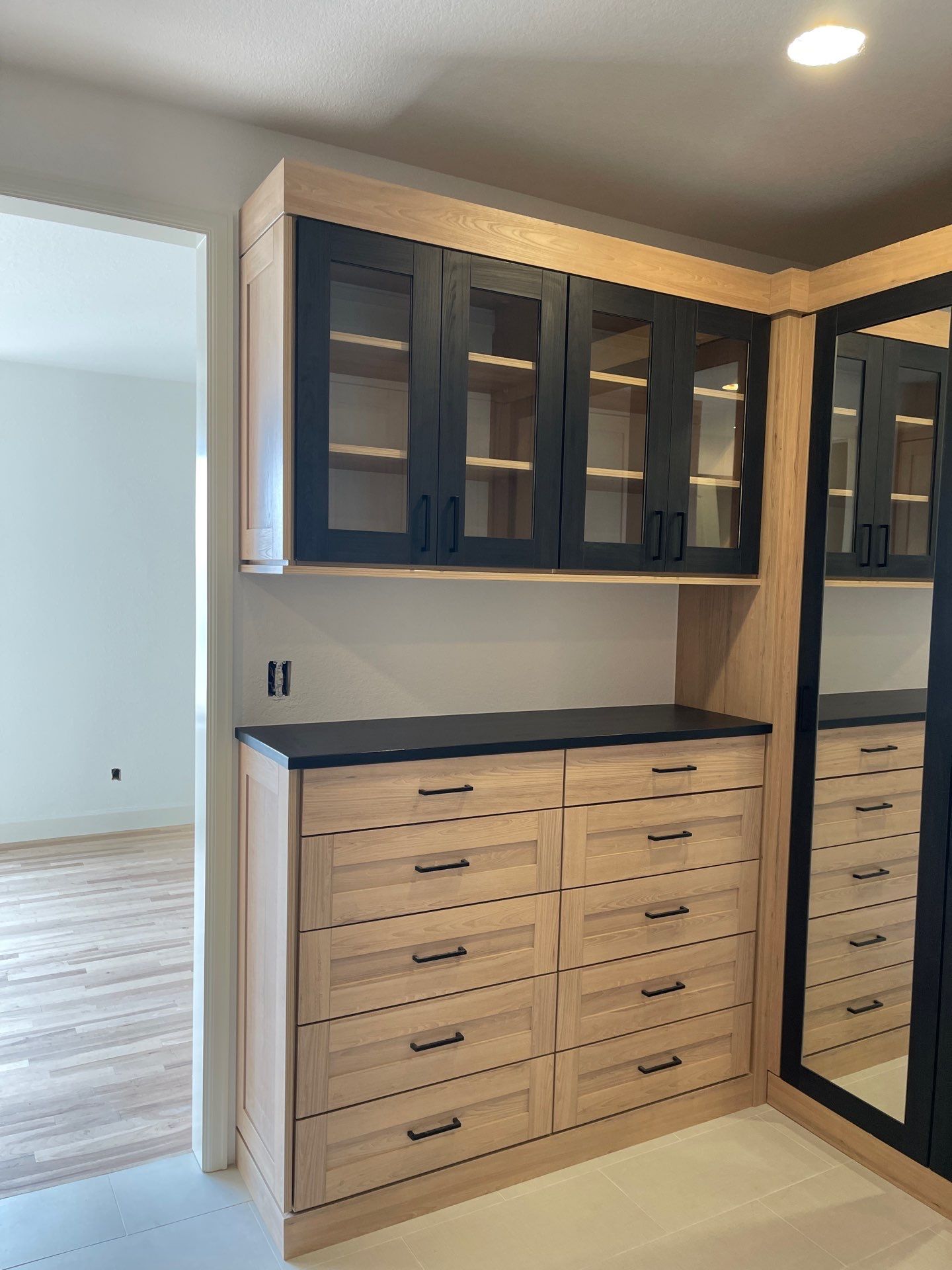 Two-Tone Closet with matching Mudroom + Laundry Room by Concept 32, Inc.