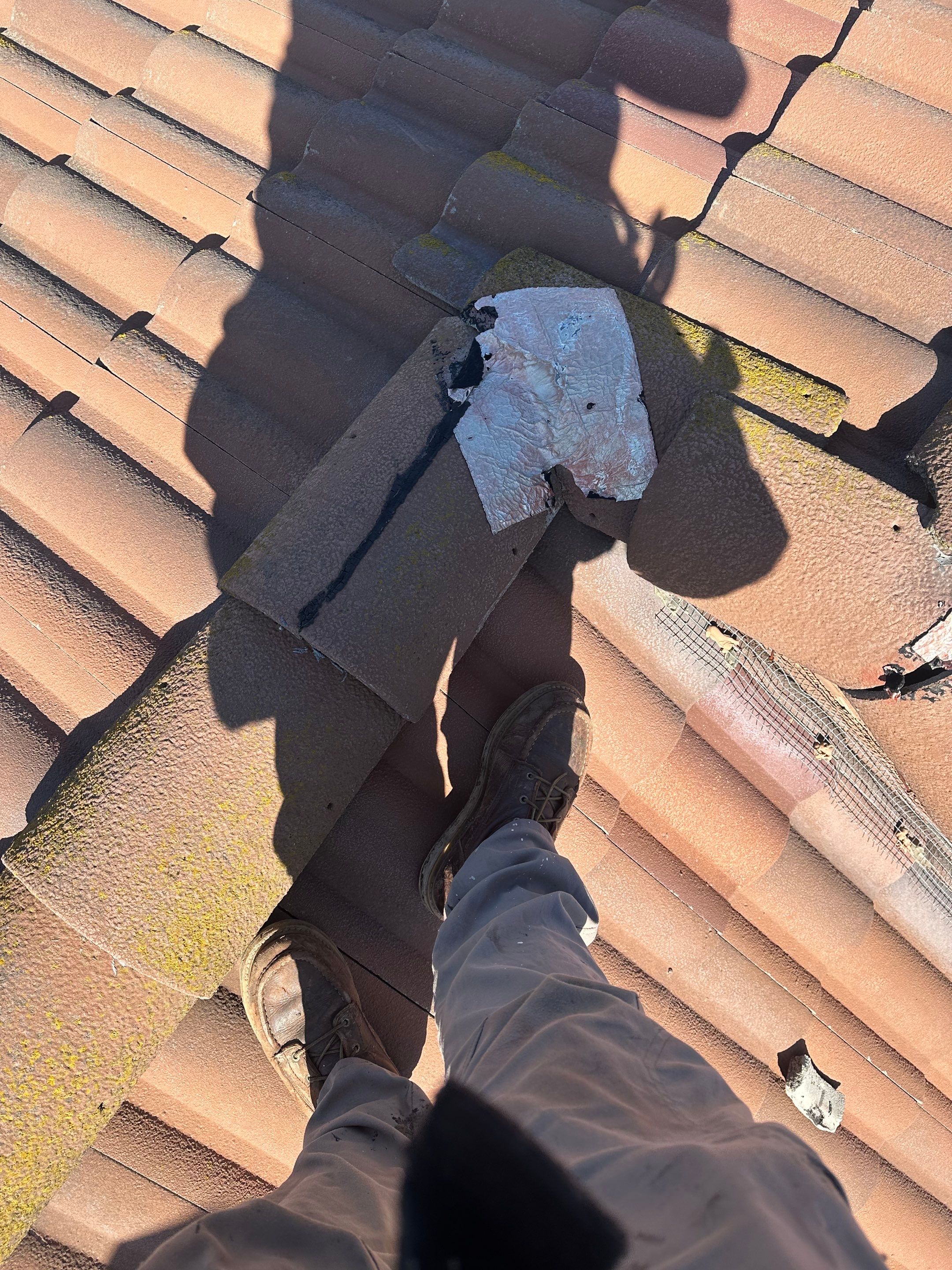 Tile Roof repair by Grandmark Service Company