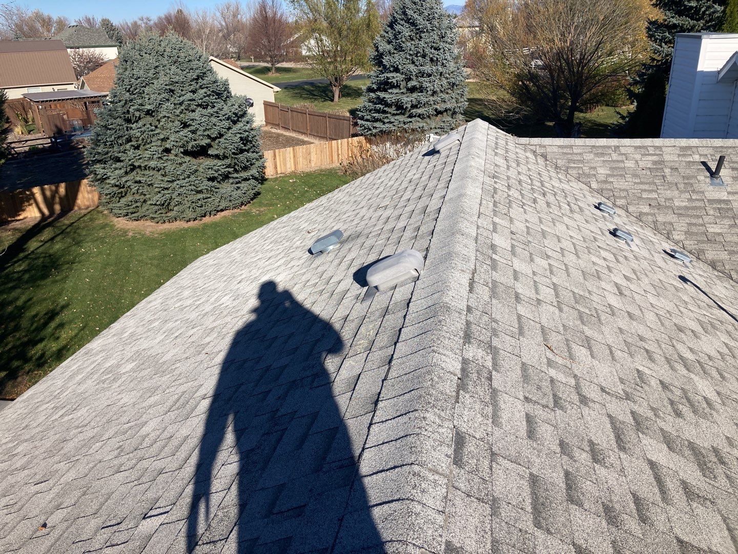 Two story farmhouse style roofing installation using Owens Corning Duration in the color Teak by ID Roofing LLC