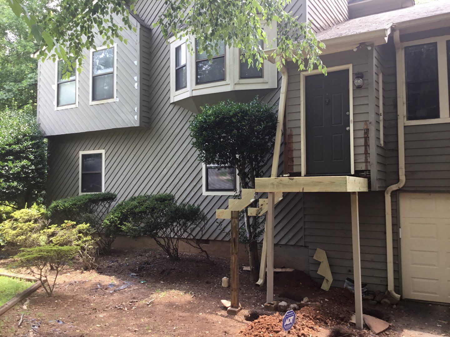 Elevated Wooden Deck and Front Porch Renovation in Marietta by Swift Home Renovations 