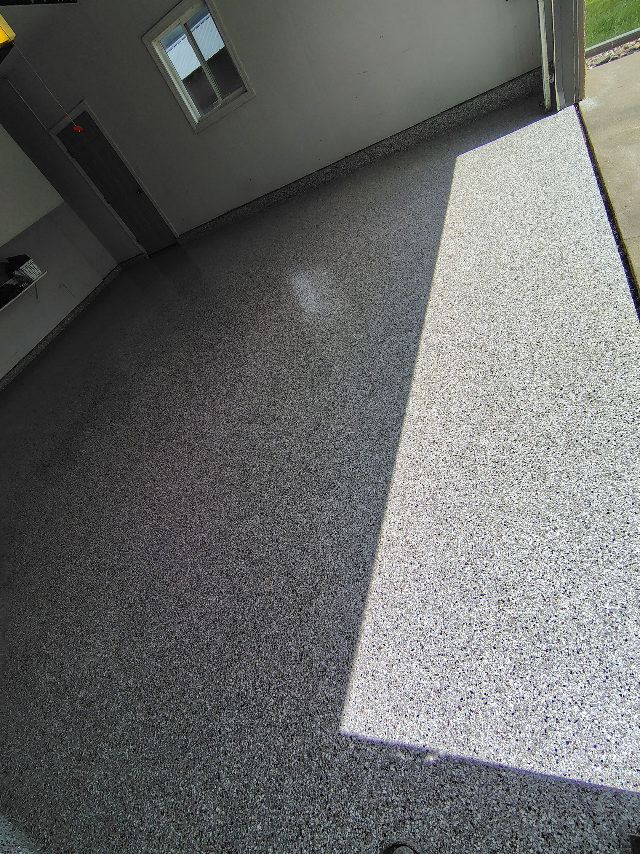 Decorative Chip Epoxy Garage Floor Coating in Sioux Falls by Select Painting, Coatings & Garage Cabinets