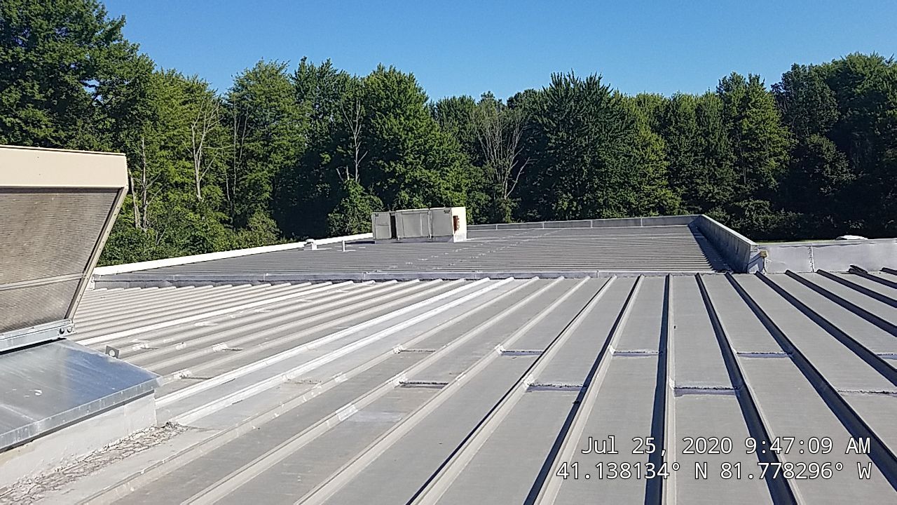Commercial Metal Roof Coating by Gold Star Roofing LLC